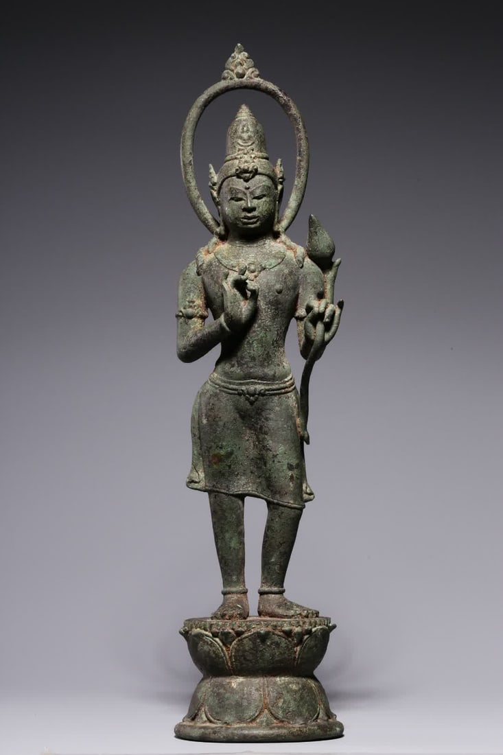 A 12th-century bronze statue of Guanyin holding a lotus (1 of 9)