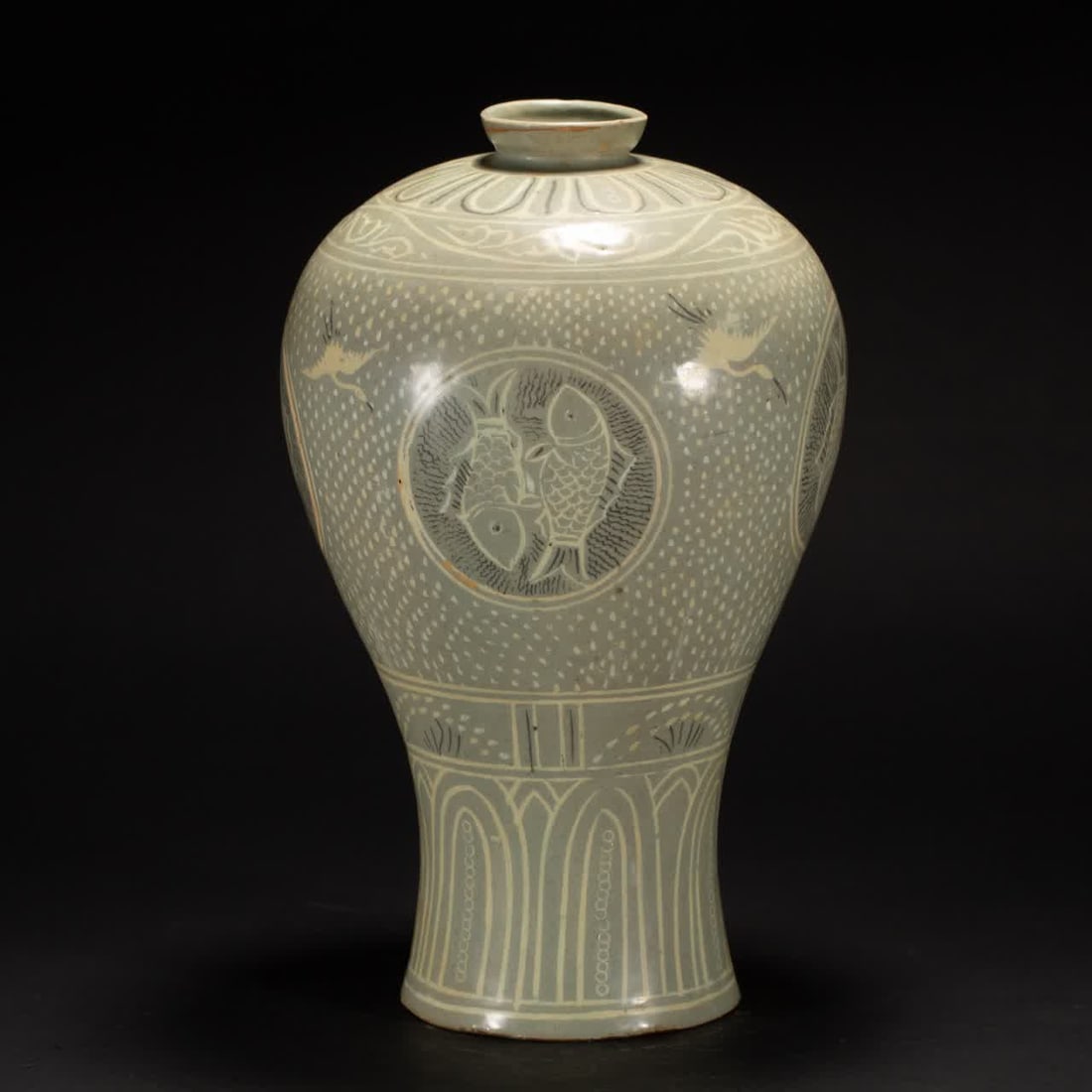A Qing Dynasty celadon fish pattern plum bottle (1 of 8)