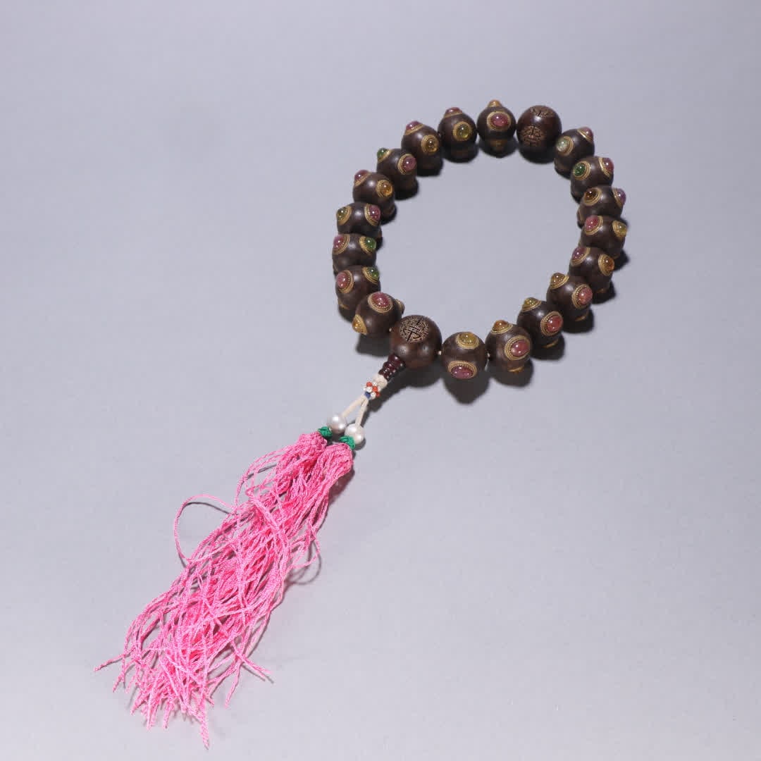 A piece of Qing Dynasty agarwood inlaid tourmaline eighteen hands: Qing Dynasty agarwood inlaid tourmaline eighteen hands SIZE: Bead diameter 2cm W: 162.4g (The Dimensions Of All Batches Are Manually Measured.If You Need More Detailed Information, Please Contact Our 