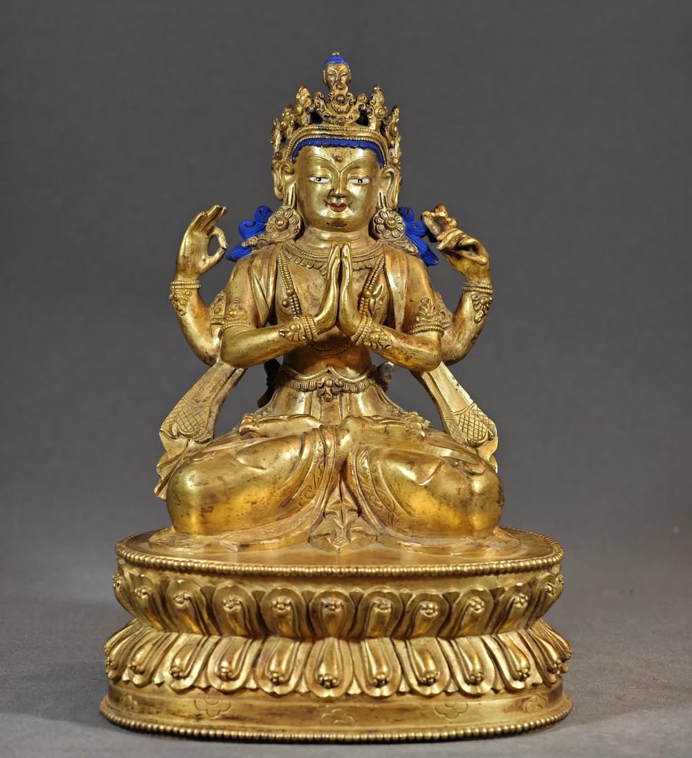 A bronze gilt four-armed Guanyin statue of the Qing Dynasty: Qing Dynasty copper gilt four-armed Guanyin statue SIZE: H:26.5cm W:3.96kg (The Dimensions Of All Batches Are Manually Measured.If You Need More Detailed Information, Please Contact Our Customer Servi