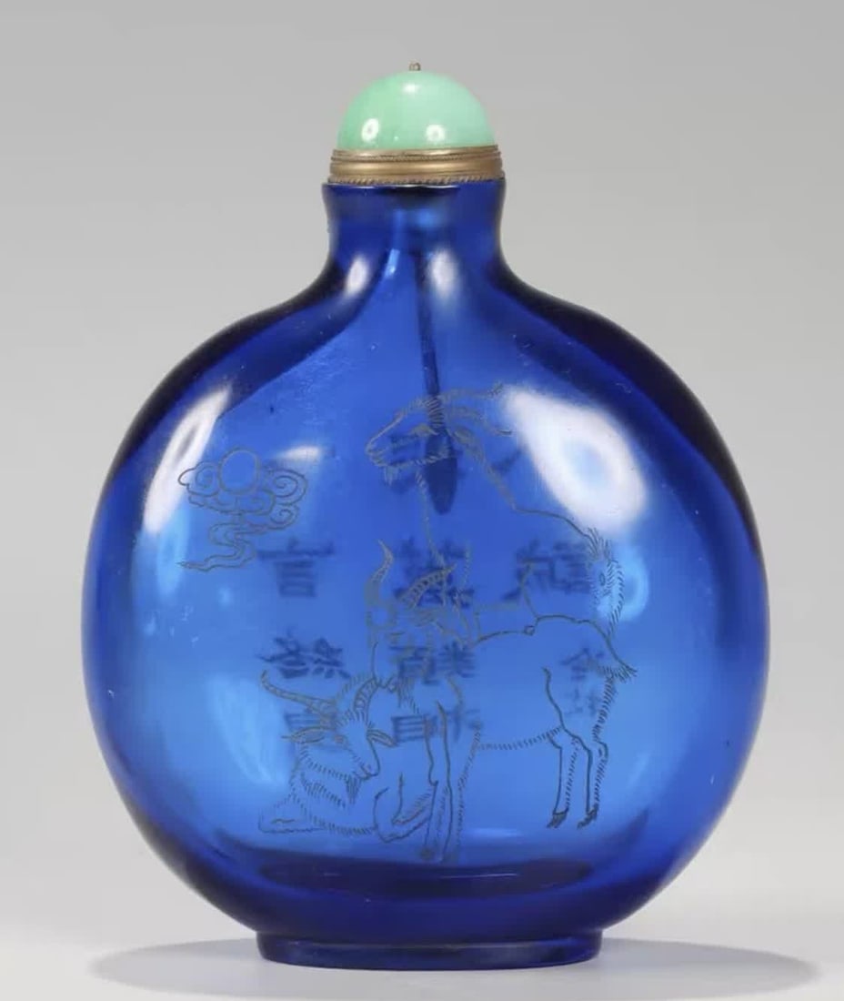 A piece of Qianlong in the Qing Dynasty made of sapphire blue material engraved with Sanyang Kaitai: Qing Dynasty Qianlong year sapphire blue material carved Sanyang Kaitai poetry snuff bottle SIZE: H:12.5cm W:9.5cm W:342.5g (The Dimensions Of All Batches Are Manually Measured.If You Need More Detail