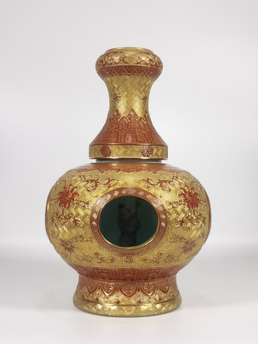 A Qing Dynasty Qianlong enamel colored gold bottom carved swastika pattern turning heart bottle (1 of 9)