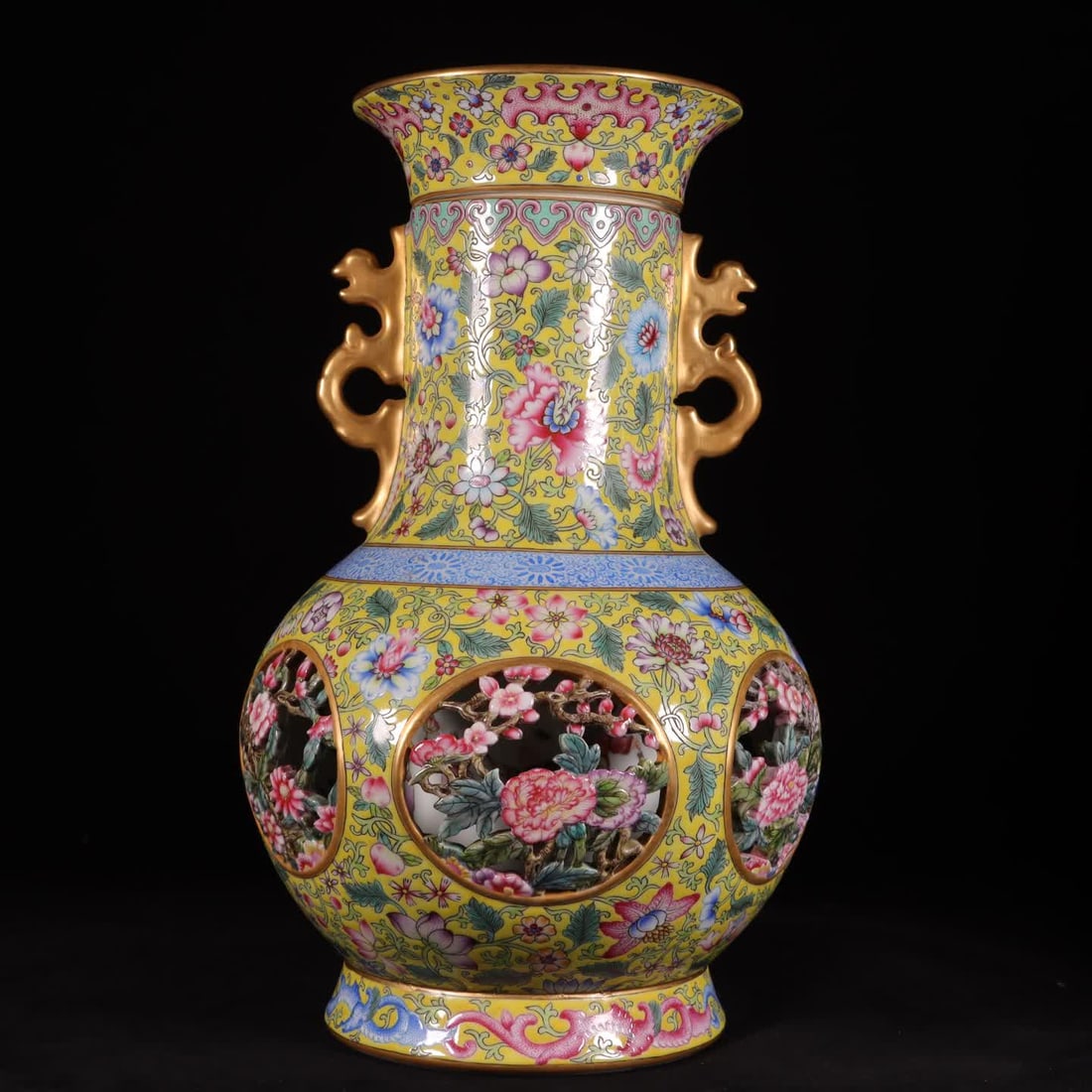 A Qing Dynasty Qianlong year enamel colorful yellow carved six-sided flower entwined lotus hollow: Qing Dynasty Qianlong year enamel colored yellow ground carved six-sided flower entwined lotus hollow heart vase SIZE: H: 32cm MouthD: 13cm Belly diameter 21cm Bottom 14cm (The Dimensions Of All Batch