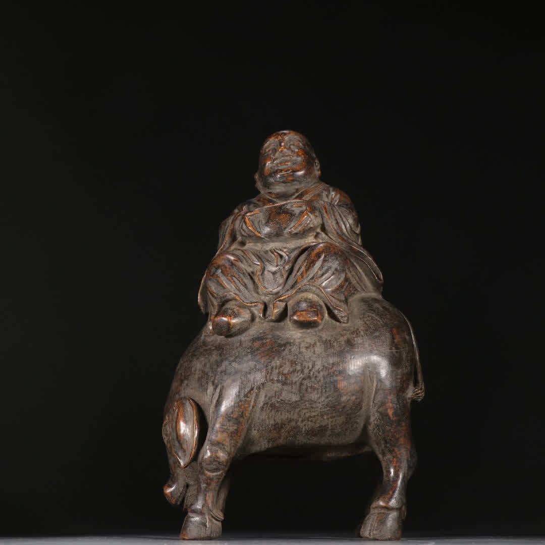 A statue of a bamboo carved shepherd boy in the Qing Dynasty holding ingots and riding pigs (1 of 9)