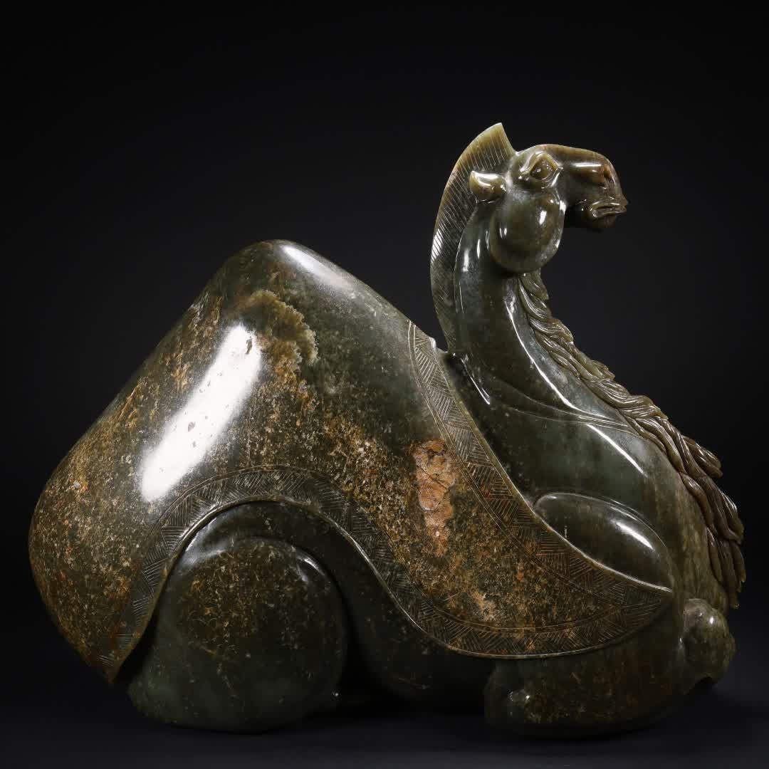 A large ornament of Hetian jasper camel in the Tang Dynasty: Tang Dynasty Hetian jasper camel ornament SIZE: 42x12x33cm W:18922g (The Dimensions Of All Batches Are Manually Measured.If You Need More Detailed Information, Please Contact Our Customer Service Befo