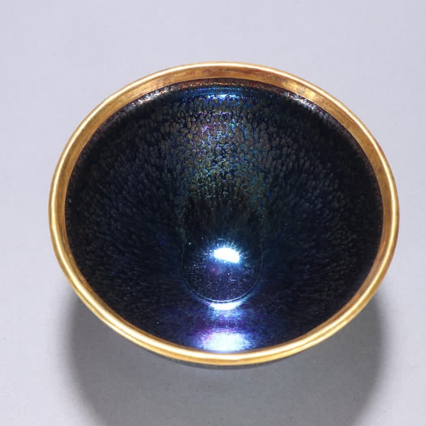 A Song Jian kiln wrapped in a golden cup: Song Jian kiln wrapped golden cups SIZE: H:7.3cm W:12.2cm (The Dimensions Of All Batches Are Manually Measured.If You Need More Detailed Information, Please Contact Our Customer Service Before Bidding