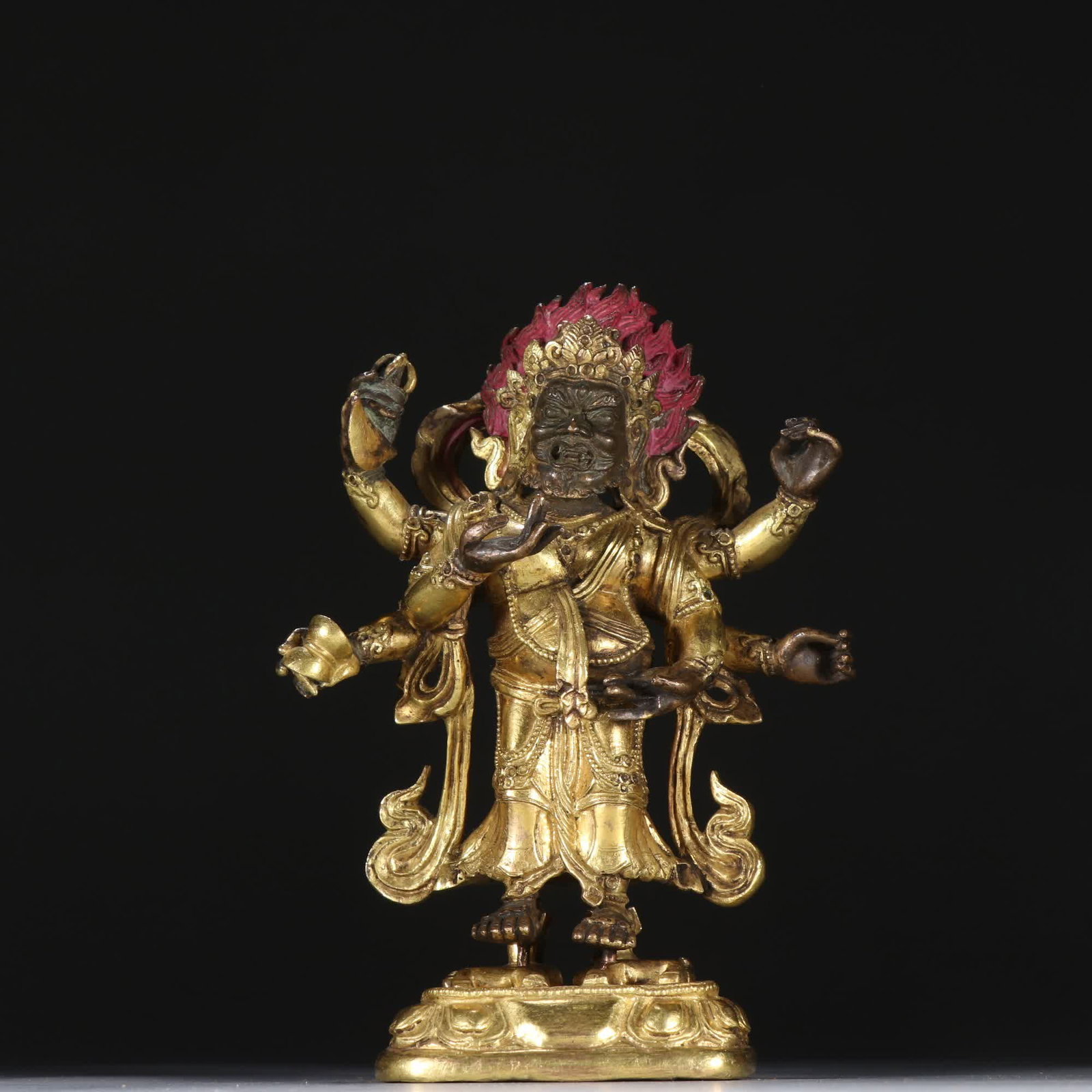 A Qing Dynasty bronze gilt six-armed black sky statue: Qing Dynasty bronze gilt six-armed large black sky statue SIZE: H:17.2cm W:12.2cm W:1255.5g (The Dimensions Of All Batches Are Manually Measured.If You Need More Detailed Information, Please Contact O
