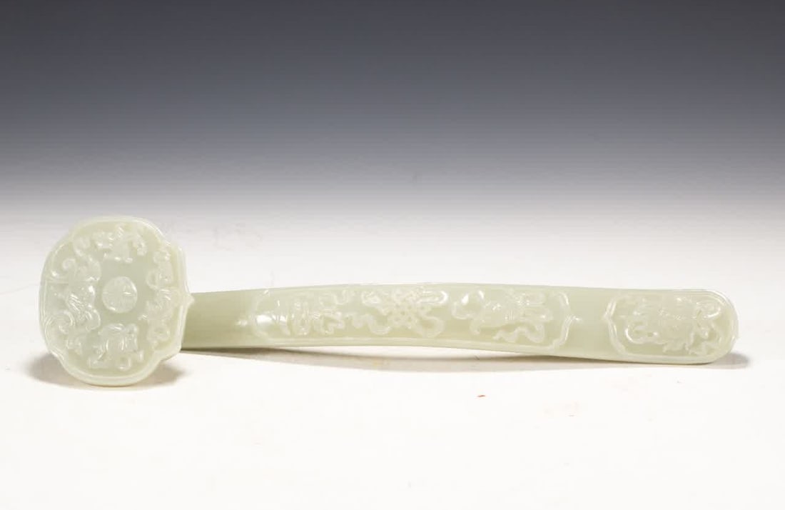 A Qing Dynasty Hetian jade ruyi ornament: Qing Dynasty Hetian jade ruyi ornament SIZE: L:34cm W:8.5cm H:6cm W:470g (The Dimensions Of All Batches Are Manually Measured.If You Need More Detailed Information, Please Contact Our Customer Service