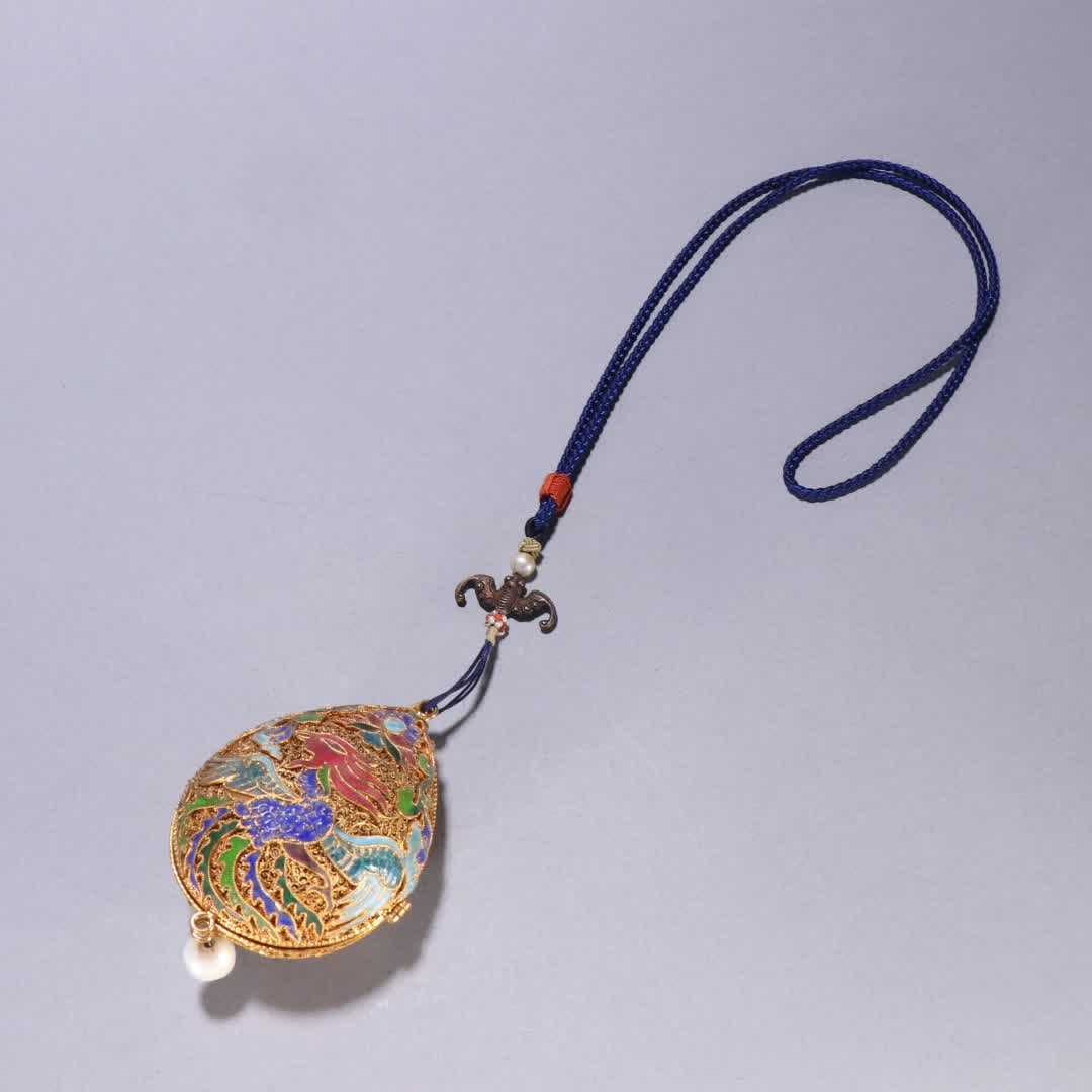 A Qing Dynasty silver-gilt blue phoenix pattern sachet pendant: Qing Dynasty silver gilt burnt blue phoenix pattern sachet pendant SIZE: H:8.4cm W:6.1cm W:68.8g (The Dimensions Of All Batches Are Manually Measured.If You Need More Detailed Information, Please Cont
