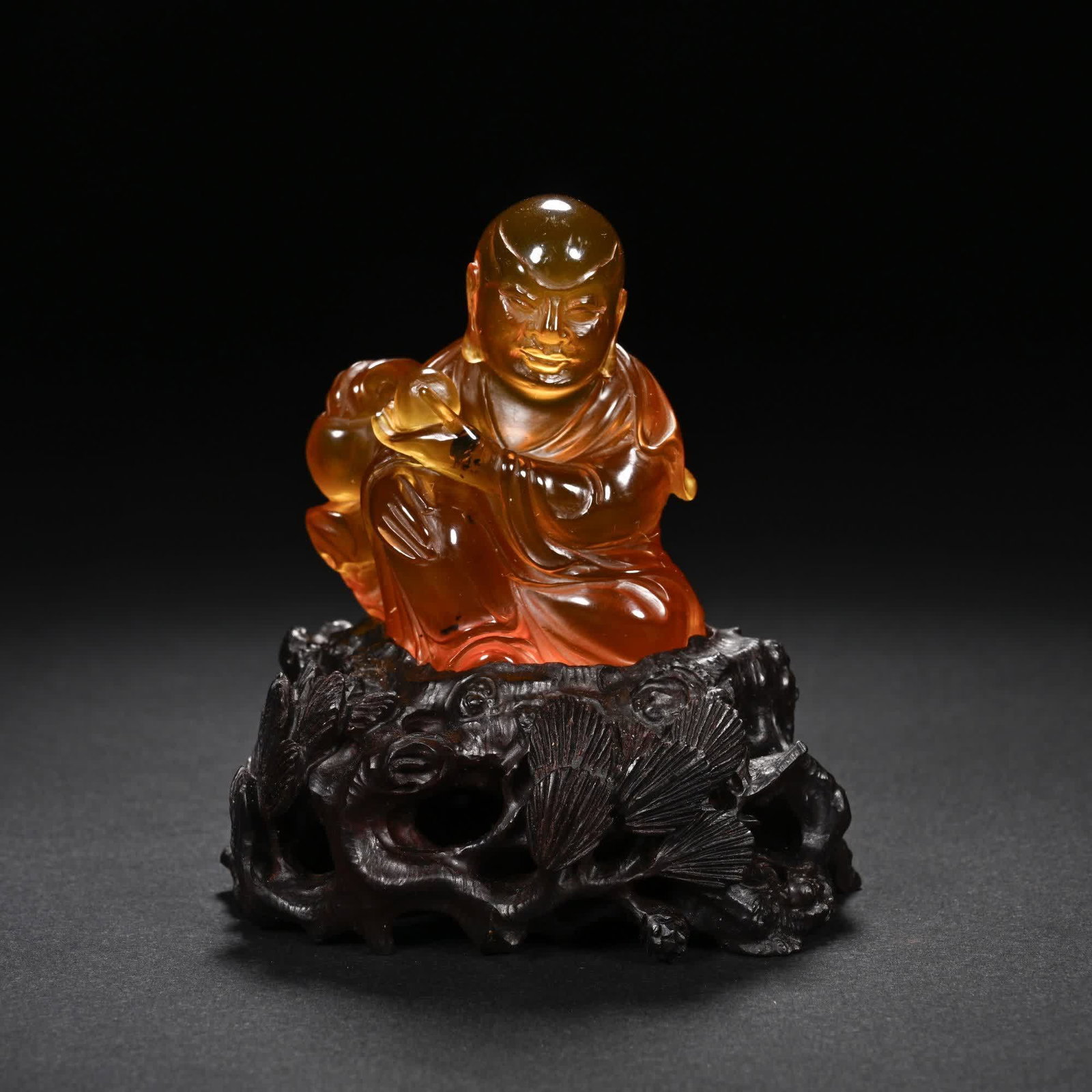 A piece of Qing Dynasty amber peach arhat (1 of 7)