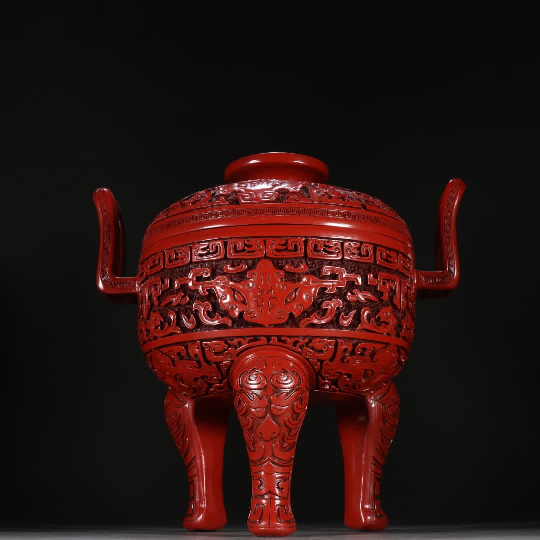 A Qing Dynasty red lacquerware gluttonous pattern three-legged aromatherapy stove: Qing Dynasty red lacquerware gluttonous pattern three-legged aromatherapy stove SIZE: H:26.5cm W:26cm W:1858.4g (The Dimensions Of All Batches Are Manually Measured.If You Need More Detailed Informati