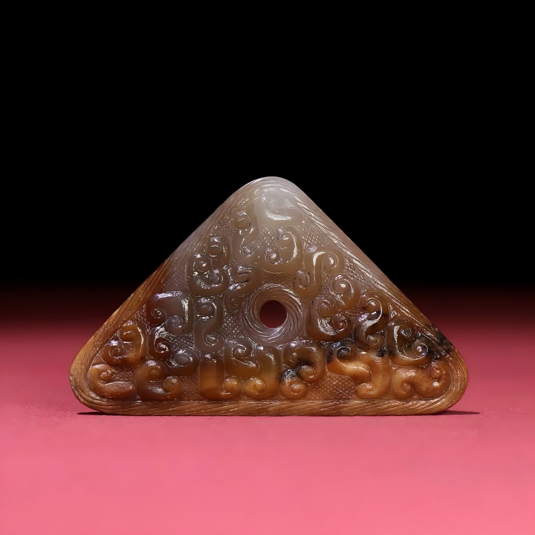A Han Dynasty jade triangle pendant: Han Dynasty jade triangle pendant SIZE: 70x42x7mm W:32g (The Dimensions Of All Batches Are Manually Measured.If You Need More Detailed Information, Please Contact Our Customer Service Before Bidding.)