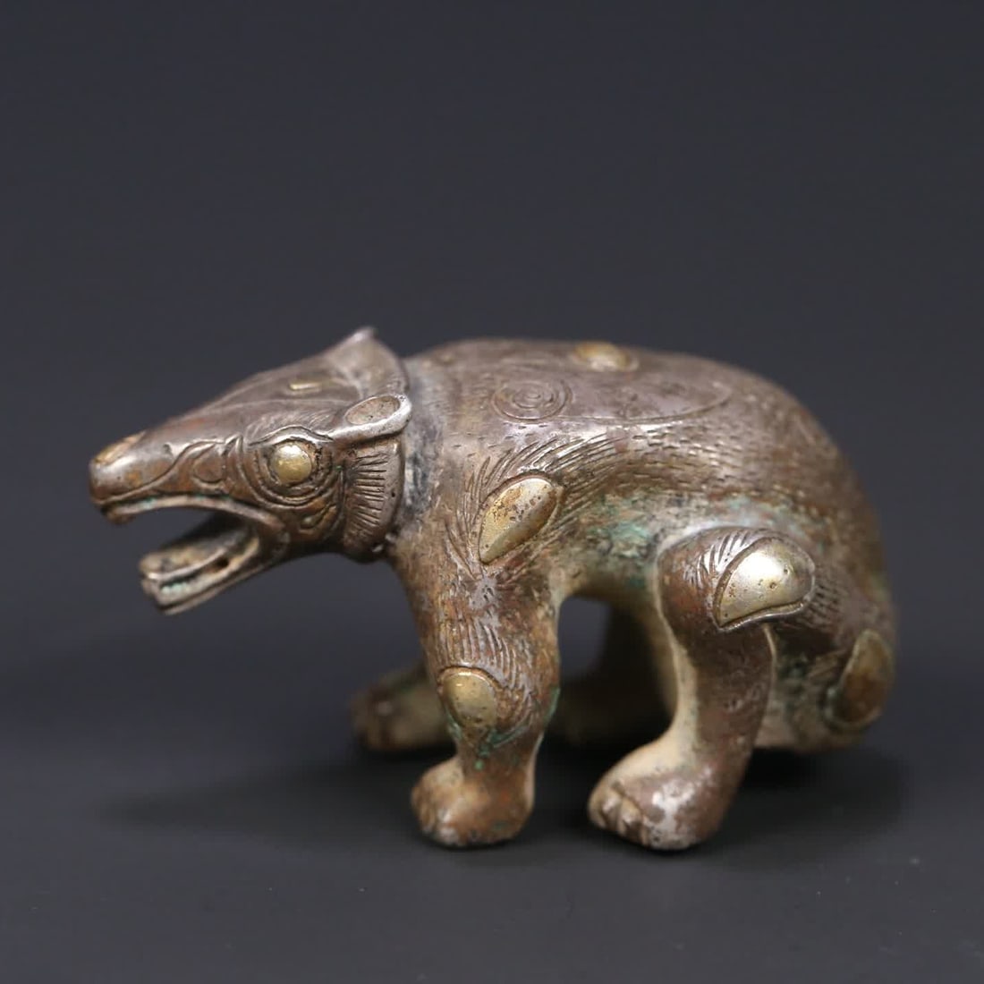 A Han Dynasty silver bear ornament (1 of 8)