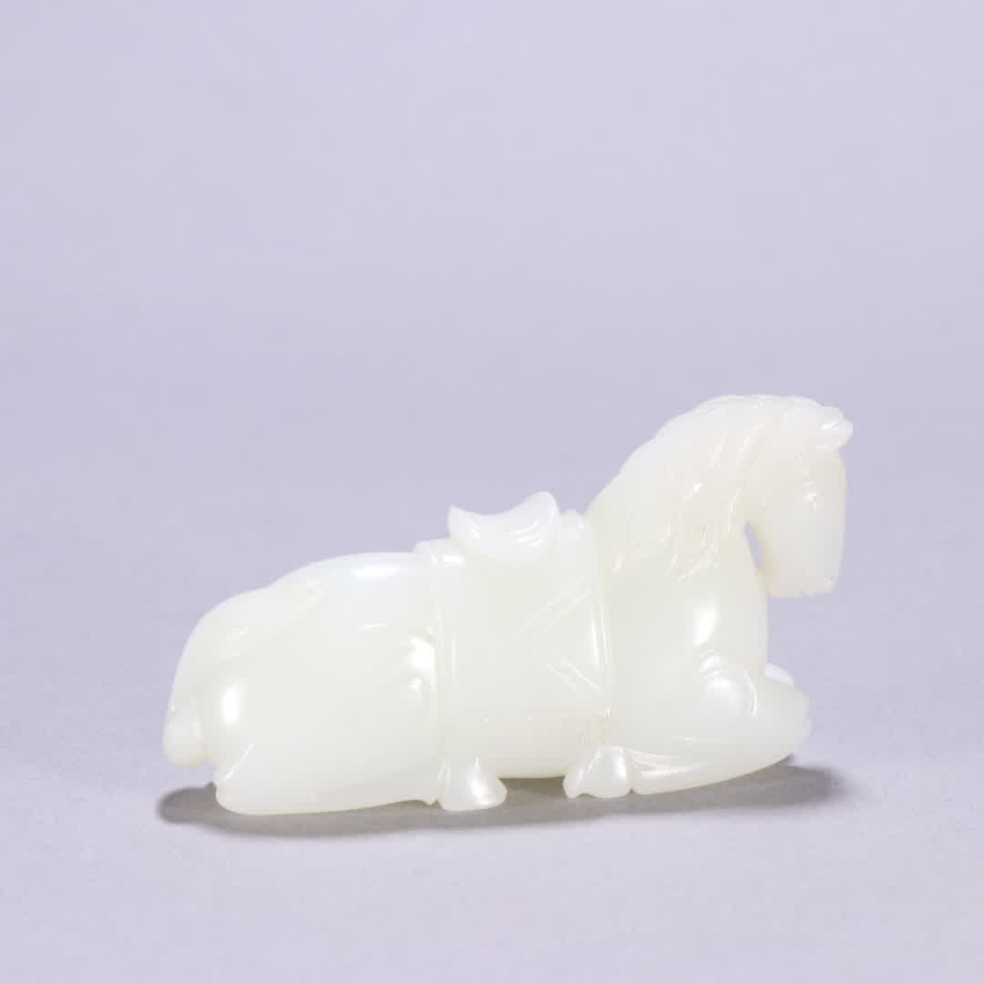 A Qing Dynasty Hetian jade reclining horse ornament: Qing Dynasty Hetian jade reclining horse ornament SIZE: H:4.3cm W:7.9cm W:97.7g (The Dimensions Of All Batches Are Manually Measured.If You Need More Detailed Information, Please Contact Our Customer 