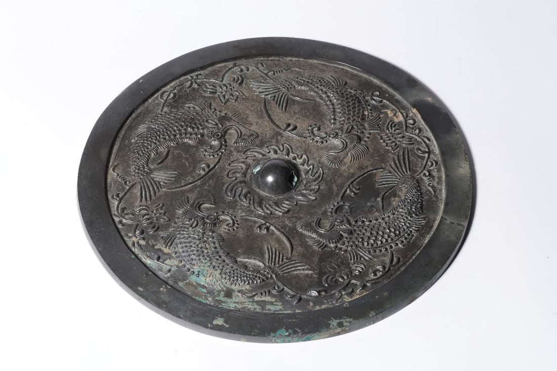A Tang Dynasty bronze four-fish mirror (1 of 6)