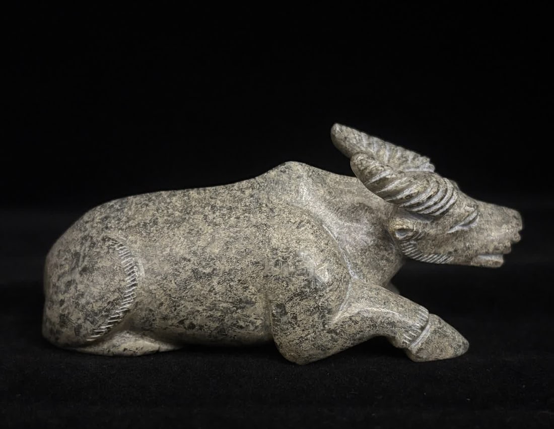 A Han Dynasty jade cow: Han Dynasty jade ox SIZE: 11x4.2x5.0cm 241g (The Dimensions Of All Batches Are Manually Measured.If You Need More Detailed Information, Please Contact Our Customer Service Before Bidding.)