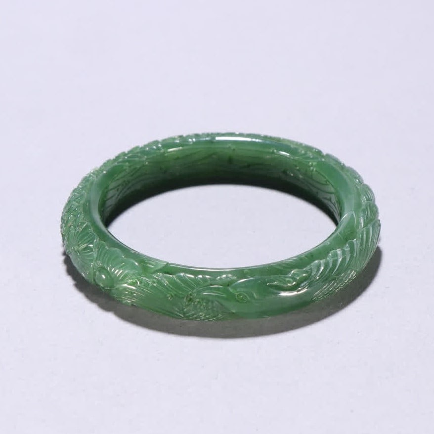 A Qing Dynasty jasper phoenix pattern bracelet: Qing Dynasty jasper phoenix pattern bracelet SIZE: Inner diameter 5.8cm W:1.2cm W:52.9g (The Dimensions Of All Batches Are Manually Measured.If You Need More Detailed Information, Please Contact Our C
