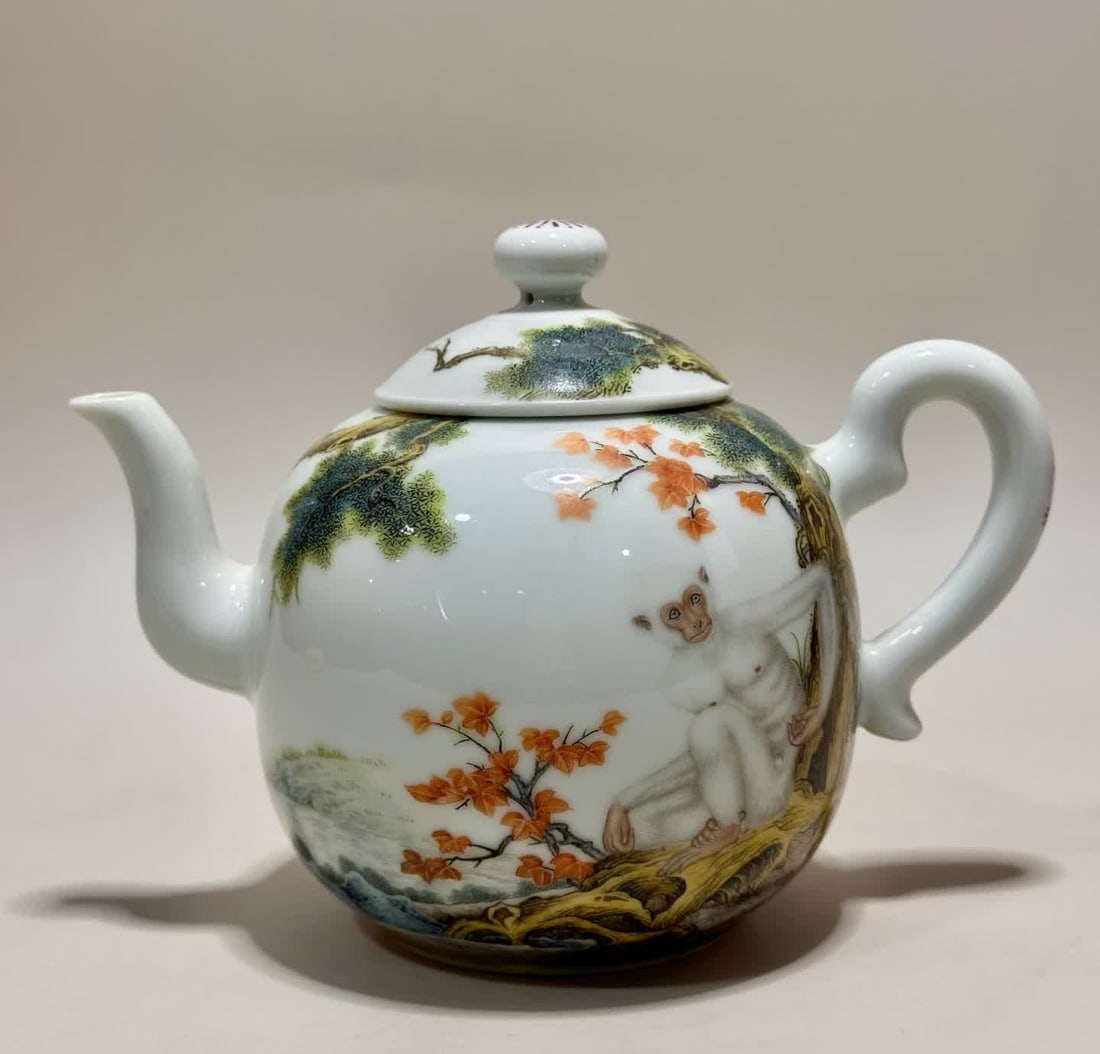 A Qianlong era enamel monkey pattern teapot: Qianlong year of the Qing Dynasty enamel monkey pattern teapot SIZE: H: 12cm MouthD: 5cm Belly diameter 16.5cm Bottom diameter 6cm (The Dimensions Of All Batches Are Manually Measured.If You Need More