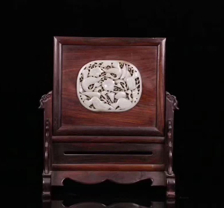 A Qing Dynasty mahogany carved phoenix pattern inlaid with Hetian jade inserts (1 of 9)