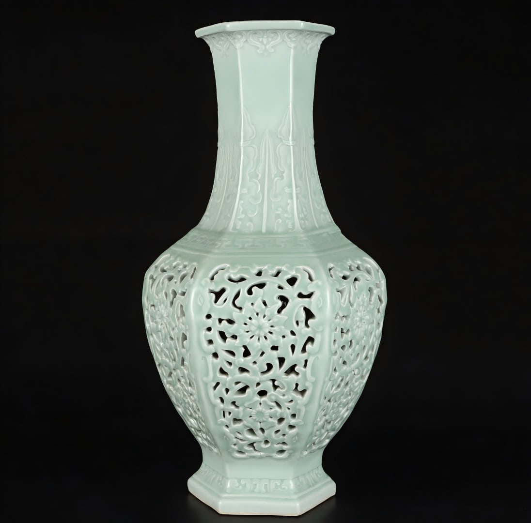 A Qing Dynasty hollow bean celadon glaze hexagonal bottle: Qing Dynasty hollow bean celadon hexagonal bottle SIZE: H: 40.7cm Belly diameter 21cm (The Dimensions Of All Batches Are Manually Measured.If You Need More Detailed Information, Please Contact Our Cus