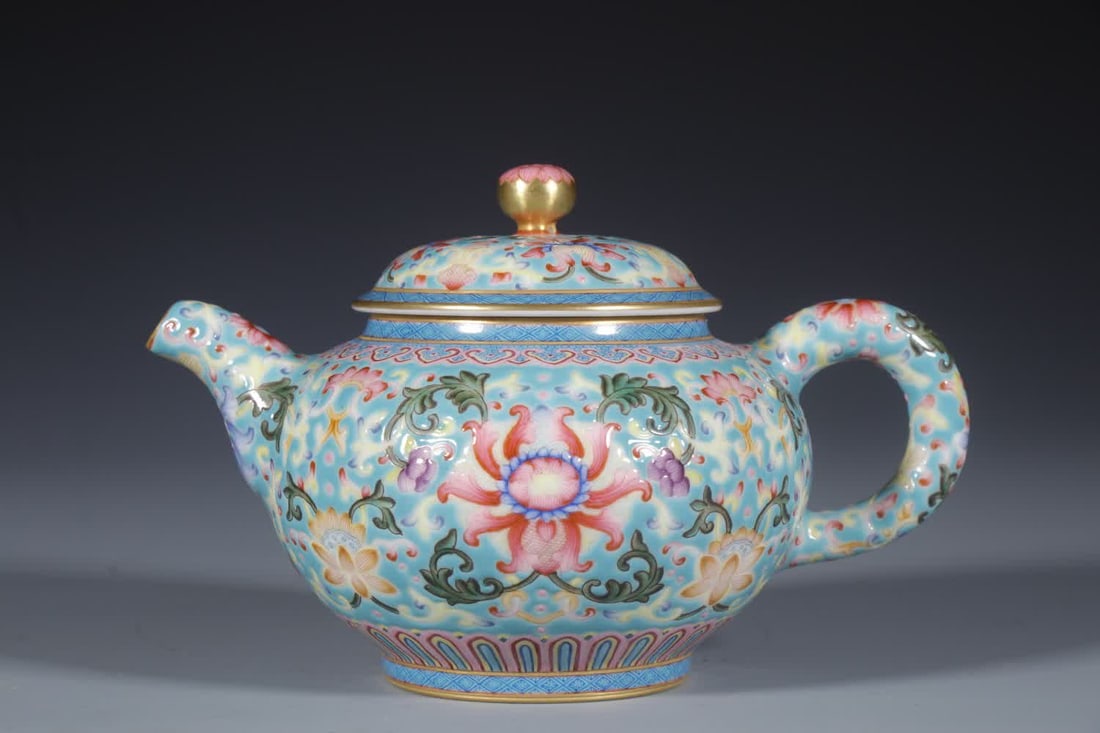 A Qing Dynasty Qianlong enamel color entwined lotus teapot: Qing Dynasty Qianlong enamel color intertwined lotus teapot SIZE: H: 10.5cm MouthD: 6.5cm Bottom 6cm (The Dimensions Of All Batches Are Manually Measured.If You Need More Detailed Information, Please 