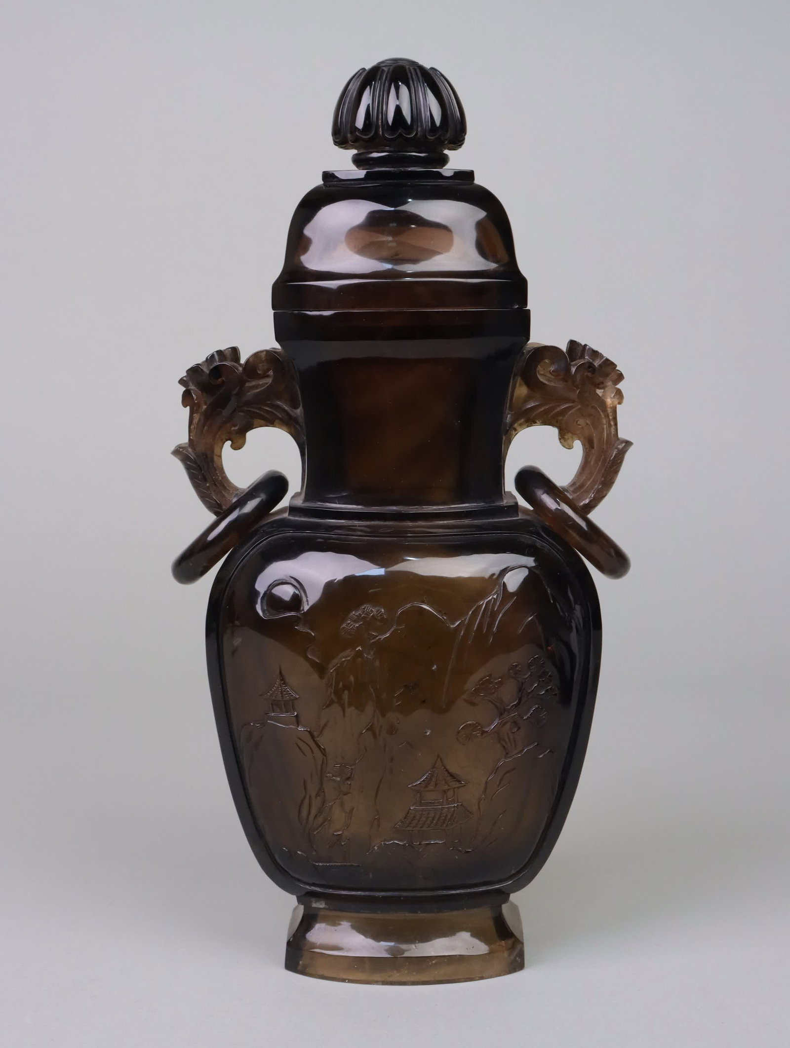 A Qing Dynasty tea crystal carved landscape pattern amphora lid bottle: Qing Dynasty tea crystal carved landscape pattern binaural lid bottle SIZE: H:28cm L:15.5cm W:7.5cm (The Dimensions Of All Batches Are Manually Measured.If You Need More Detailed Information, Please C