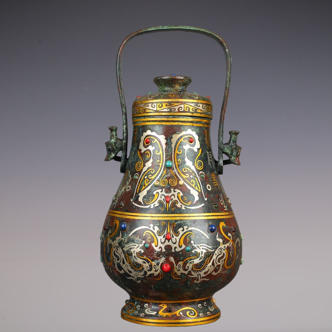 An Exquisite Bronze Inlaid Gold Inlaid Gems Dragon Pattern Ewer: An Exquisite Bronze Inlaid Gold Inlaid Gems Dragon Pattern Ewer Han Dynasty, China Size:16cmx15cmx30cm Weight:1840g (The Dimensions Of All Batches Are Manually Measured.If You Need More Detailed