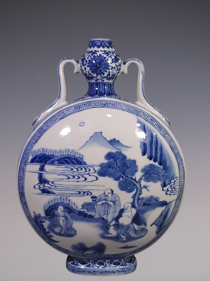 An Exquisite Blue and White Lotus Pattern Landscape and Figure Pattern Double-Ears Vase: An Exquisite Blue and White Lotus Pattern Landscape and Figure Pattern Double-Ears Vase Qing Dynasty, China Qianlong Six-character Mark Size:41.8cmx4.3cm (The Dimensions Of All Batches Are Manually Me