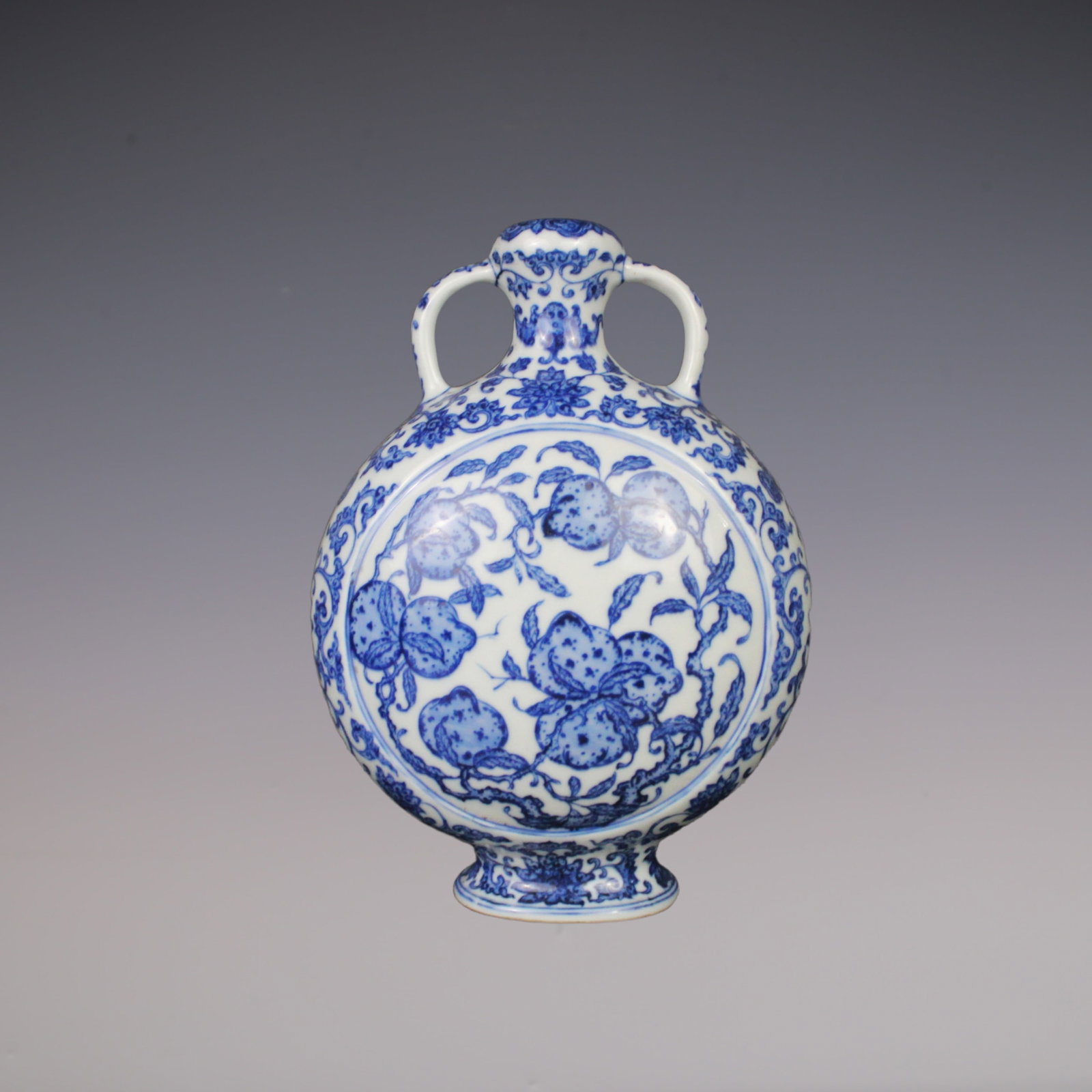 An Exquisite Blue and White Lotus Pattern Bats and Peach Pattern Double-Ears Vase: An Exquisite Blue and White Lotus Pattern Bats and Peach Pattern Double-Ears Vase Qing Dynasty, China Qianlong Six-character Mark Size:23.5cmx8cm (The Dimensions Of All Batches Are Manually Measured.I