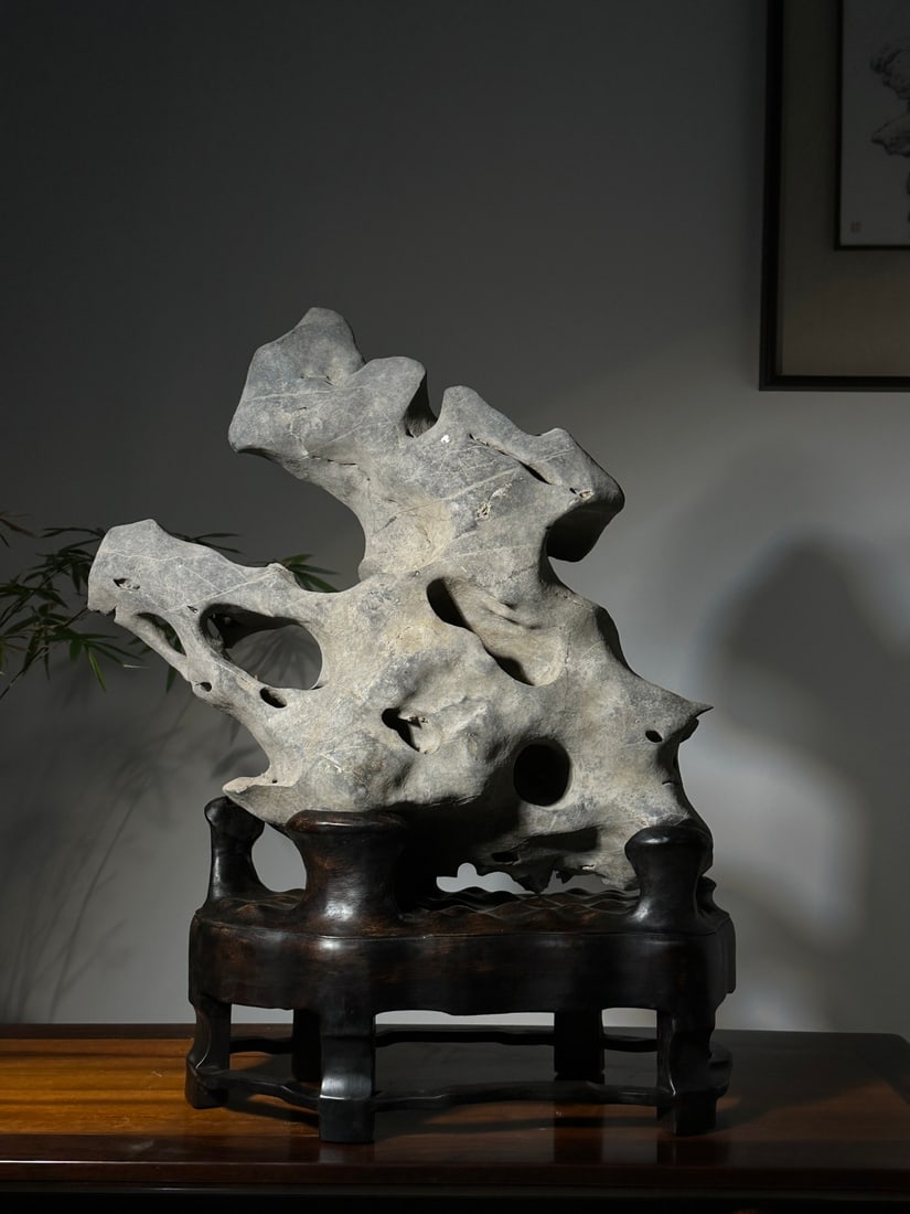 An Exquisite Taihu Stone Ornament: An Exquisite Taihu Stone Ornament Qing Dynasty, China Size:68cmx54cmx21cm (The Dimensions Of All Batches Are Manually Measured.If You Need More Detailed Information, Please Contact Our Customer Servic