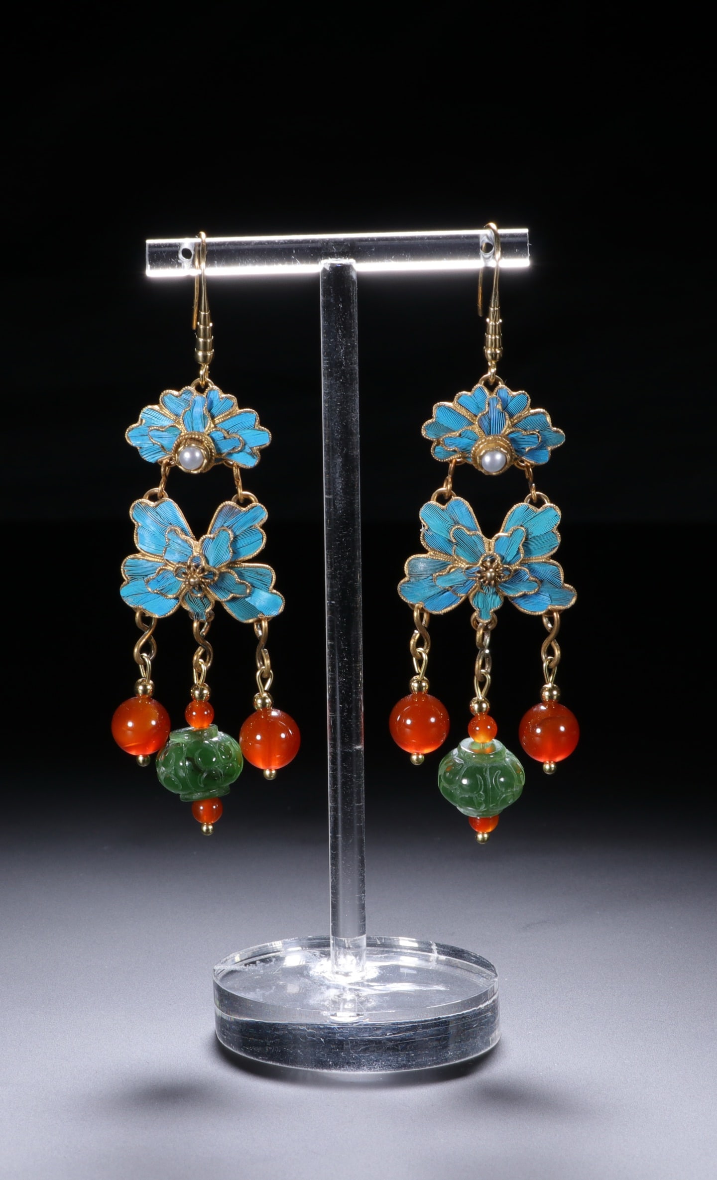 An Exquisite Gilt Bronze Inlaid Gems Earrings: An Exquisite Gilt Bronze Inlaid Gems Earrings Qing Dynasty, China Size:8.2cmx2.3cm (The Dimensions Of All Batches Are Manually Measured.If You Need More Detailed Information, Please Contact Our Custom