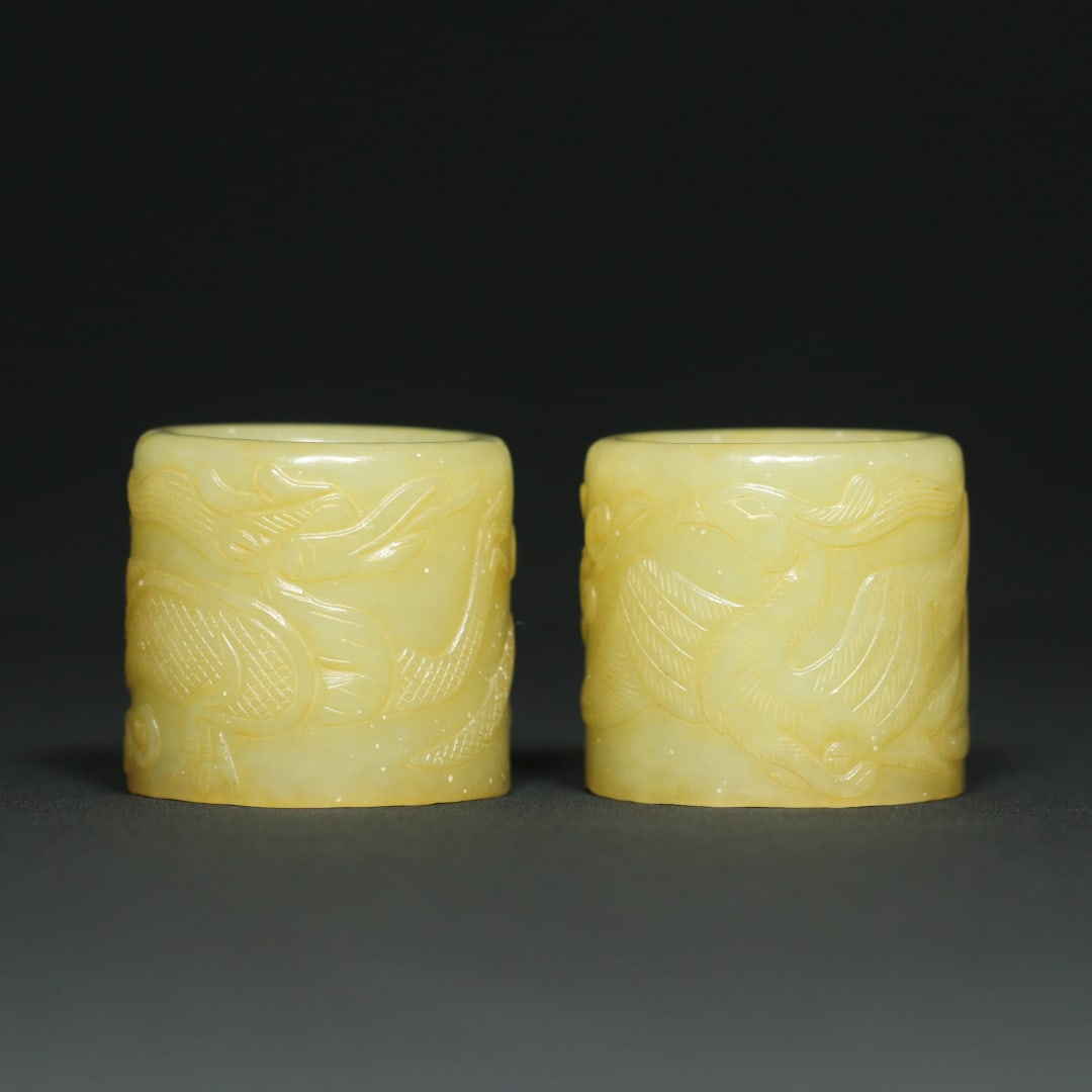 A Pair of Exquisite White Jade Dragon and Phoenix Pattern Ring: A Pair of Exquisite White Jade Dragon and Phoenix Pattern Ring Han Dynasty, China Size:3.2cmx3.5cm Size:(inside diameter)2.2cm Weight:94.3g (The Dimensions Of All Batches Are Manually Measured.If You 