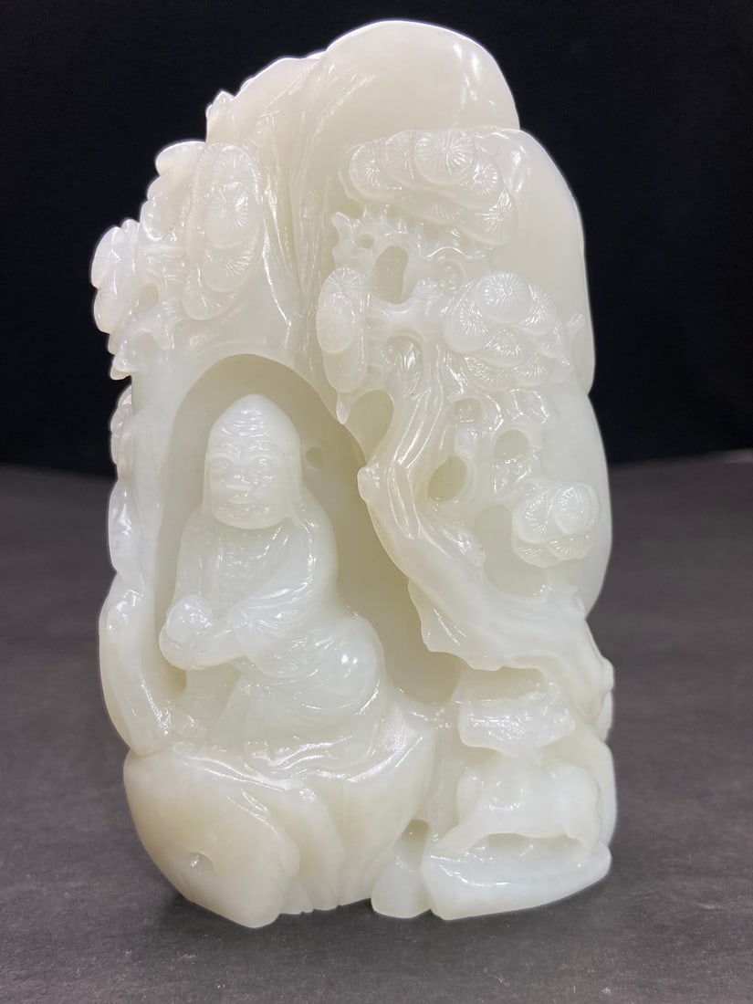 An Exquisite White Jade Statue of Arhat Pattern Rockery Ornament: An Exquisite White Jade Statue of Arhat Pattern Rockery Ornament Qing Dynasty, China Size:11.68cmx7.4cmx4.1cm Weight:466g (The Dimensions Of All Batches Are Manually Measured.If You Need More Detailed
