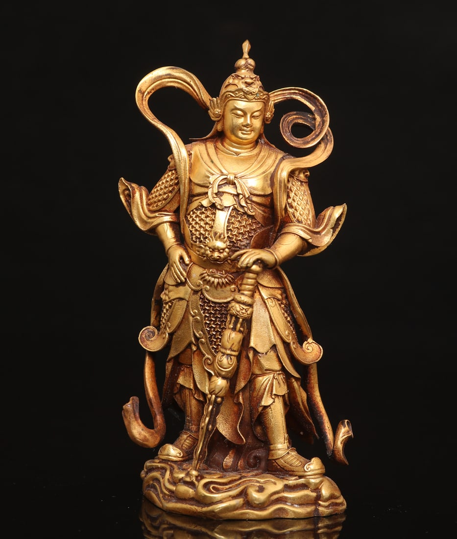 An Exquisite Gilt Bronze Statue of Skanda Ornament: An Exquisite Gilt Bronze Statue of Skanda Ornament Ming Dynasty, China Size:11cmx5cm Weight:339g (The Dimensions Of All Batches Are Manually Measured.If You Need More Detailed Information, Please Cont