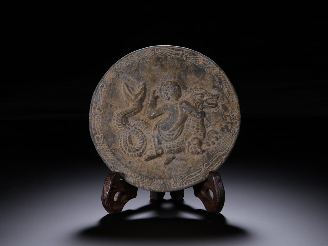 An Exquisite Stone Character and Story Pattern Round Mirror: An Exquisite Stone Character and Story Pattern Round Mirror Tang Dynasty, China Size:12.1cm (The Dimensions Of All Batches Are Manually Measured.If You Need More Detailed Information, Please Contact O