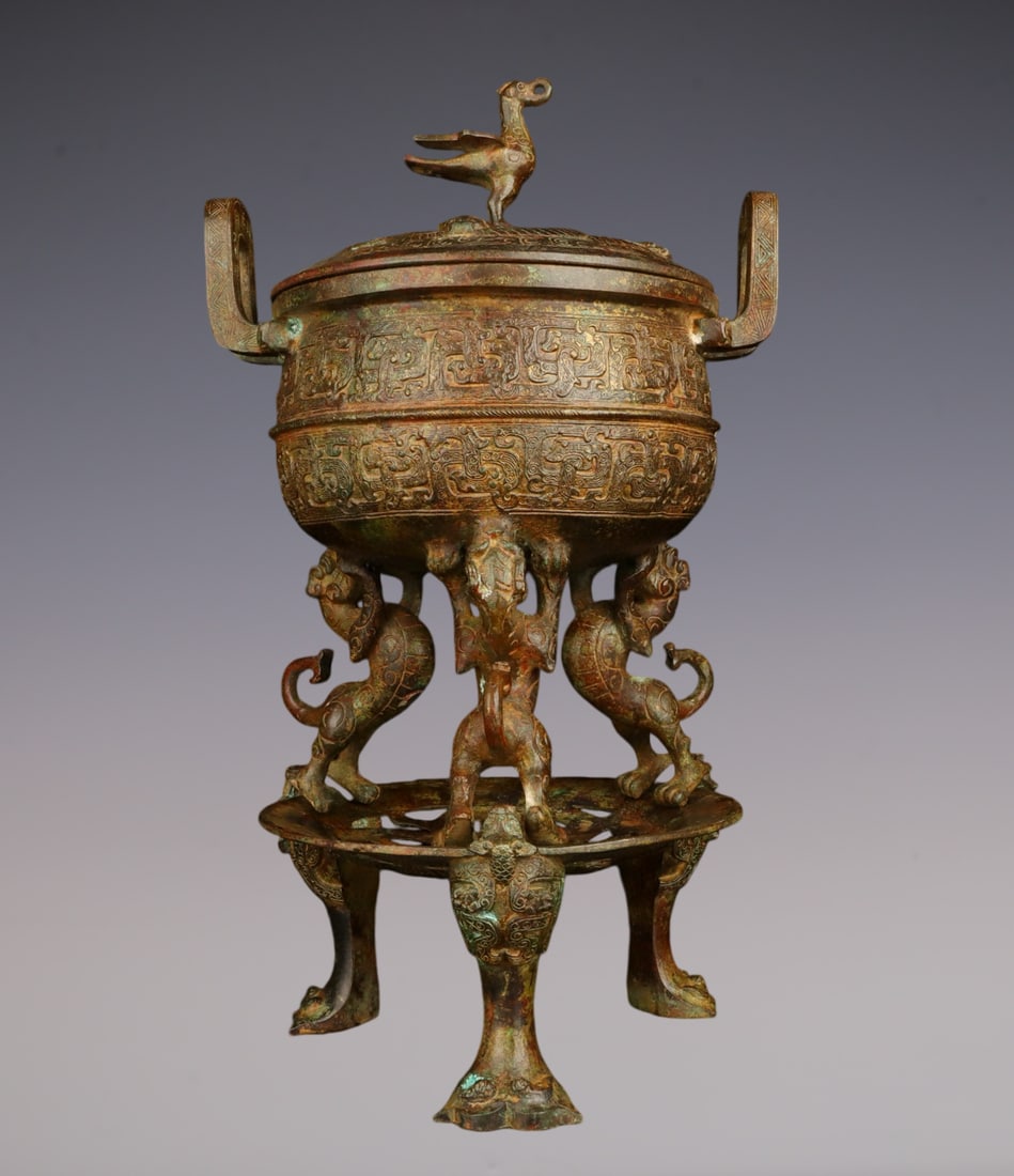 An Exquisite Bronze Auspicious Beast Pattern Double-Ears and Tripod Censer: An Exquisite Bronze Auspicious Beast Pattern Double-Ears and Tripod Censer Han Dynasty, China Size:26.5cmx48cm Weight:7440g (The Dimensions Of All Batches Are Manually Measured.If You Need More Detail