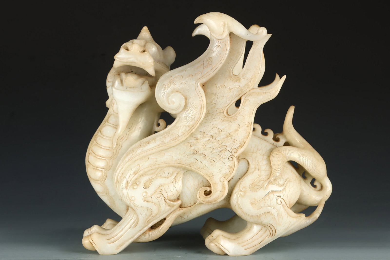 An Exquisite White Jade Auspicious Beast Ornament: An Exquisite White Jade Auspicious Beast Ornament Qing Dynasty, China Qianlong Four-character Mark Size:28cmx30cm Weight:9165g (The Dimensions Of All Batches Are Manually Measured.If You Need More Det