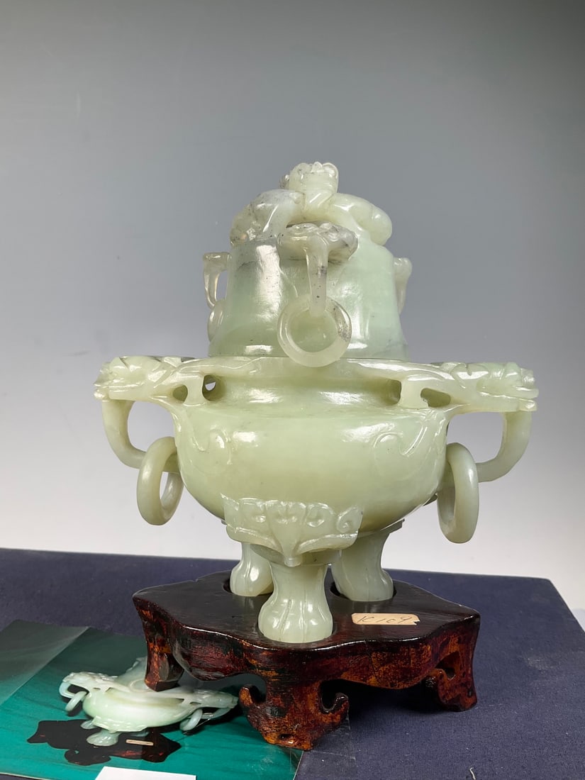 An Exquisite Serpentine Jade Beast-Face Pattern Double-Ears and Tripod Censer: An Exquisite Serpentine Jade Beast-Face Pattern Double-Ears and Tripod Censer Modern Time of China Size:17cmx14cm Weight:785g (The Dimensions Of All Batches Are Manually Measured.If You Need More Deta