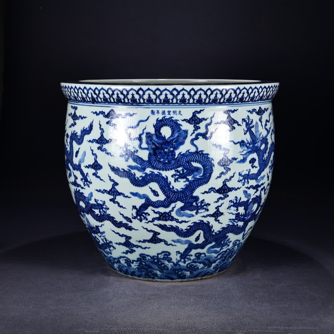 A large jar with a nine-dragon pattern in the Ming Dynasty Xuande blue and white seawater: Ming Dynasty Xuande blue and white sea water auspicious cloud nine-dragon pattern large vat SIZE: H:50cm W:58cm (The Dimensions Of All Batches Are Manually Measured.If You Need More Detailed Informati
