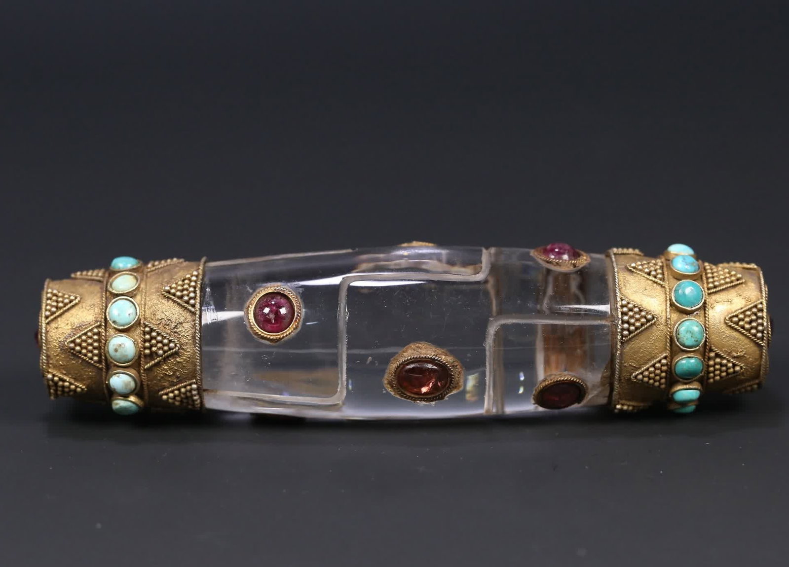 A Qing Dynasty crystal-clad copper-gilt inlaid turquoise tourmaline gemstone nine-eyed dzi (1 of 8)