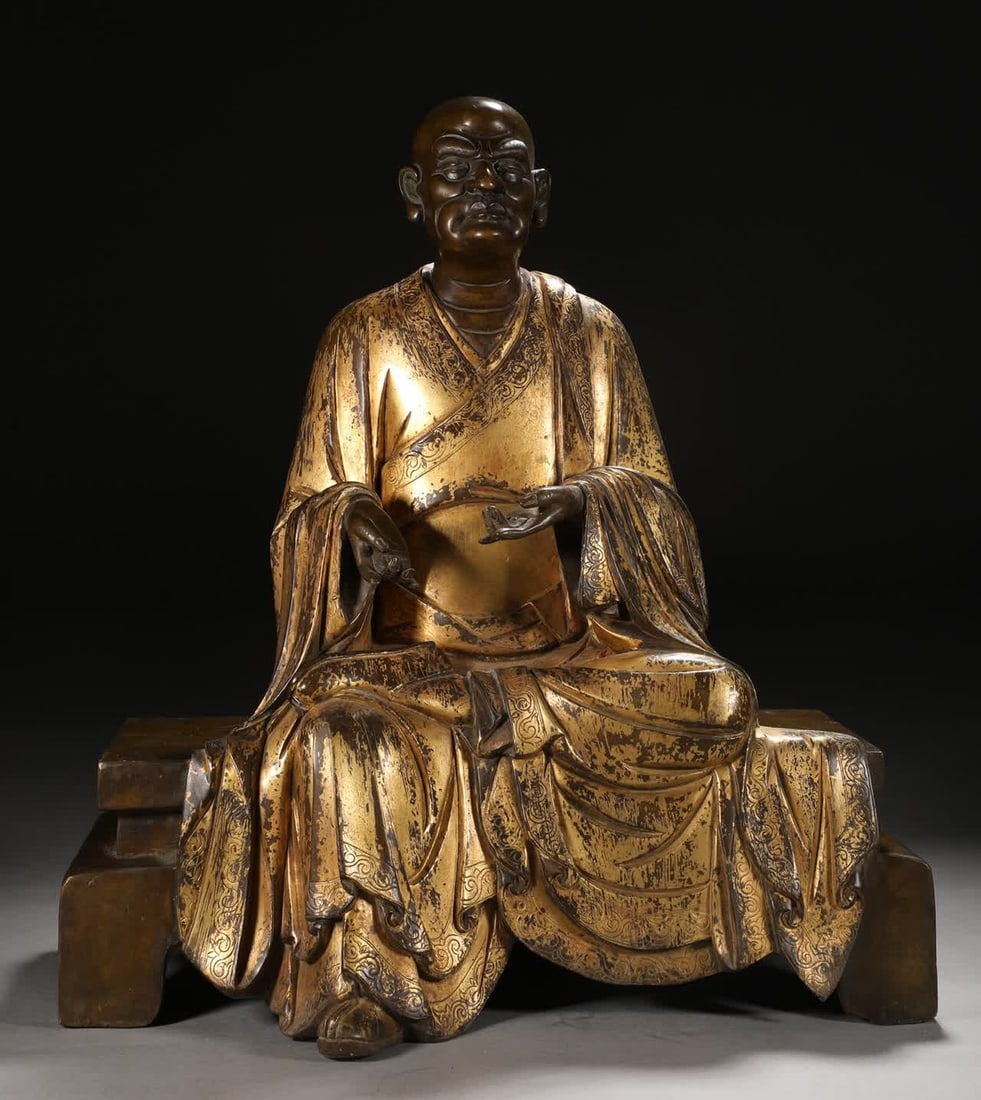 A Qing Dynasty bronze gilt Arhat statue (1 of 9)