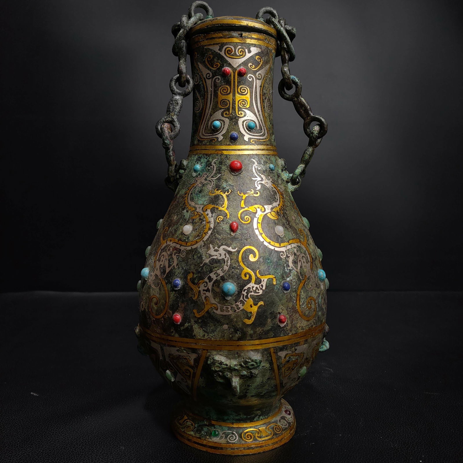 A Han Dynasty Cuo gold and silver inlaid gemstone dragon pattern beam copper pot: Han Dynasty Cuo gold and silver inlaid gemstone dragon pattern beam copper pot SIZE: L:13cm W:13cm H:31cm W:1.9kg (The Dimensions Of All Batches Are Manually Measured.If You Need More Detailed Informa