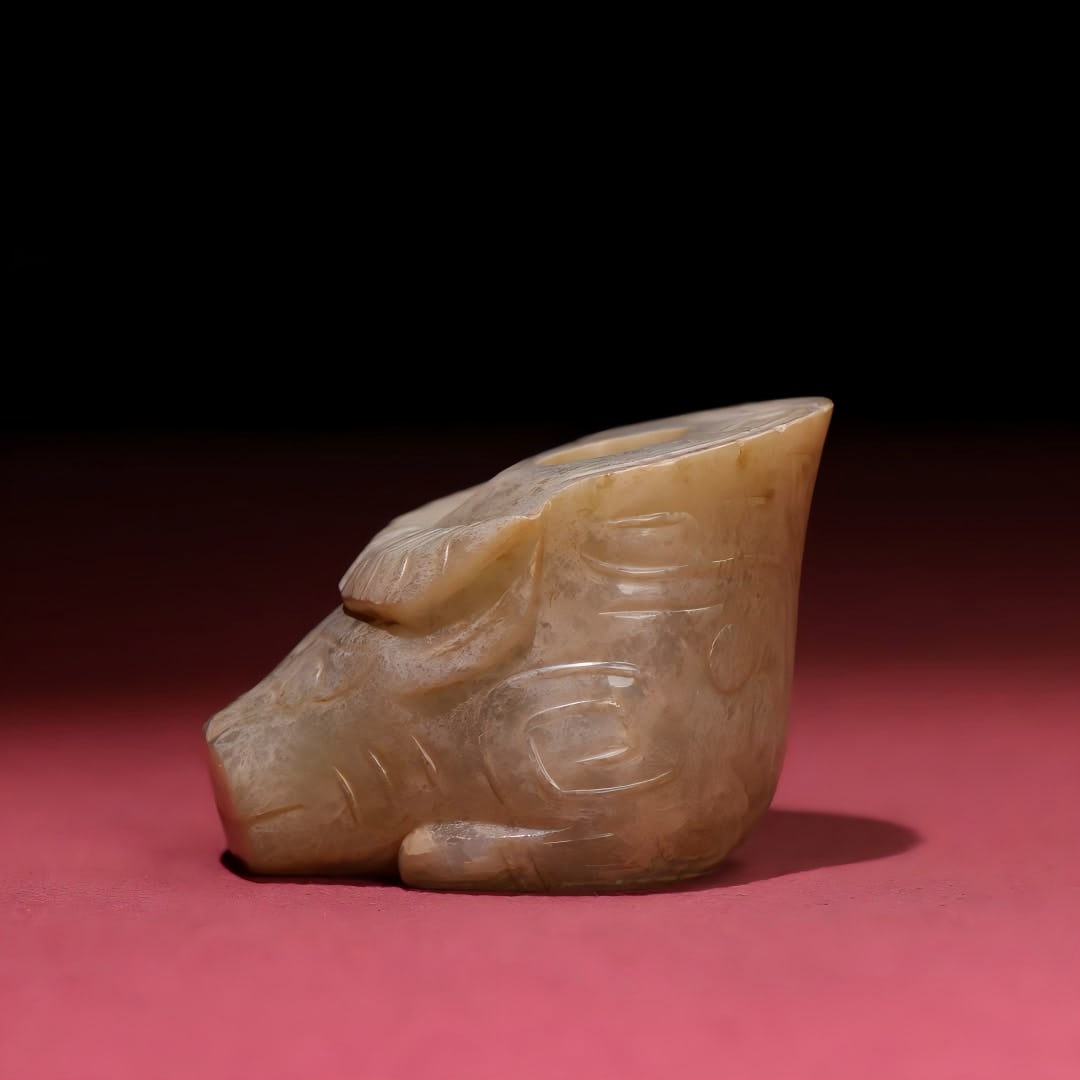 A Han Dynasty jade cow head to the sky hole handle: Han Dynasty jade bull head to the sky hole handle SIZE: 63x58x44mm W:138g (The Dimensions Of All Batches Are Manually Measured.If You Need More Detailed Information, Please Contact Our Customer Servic
