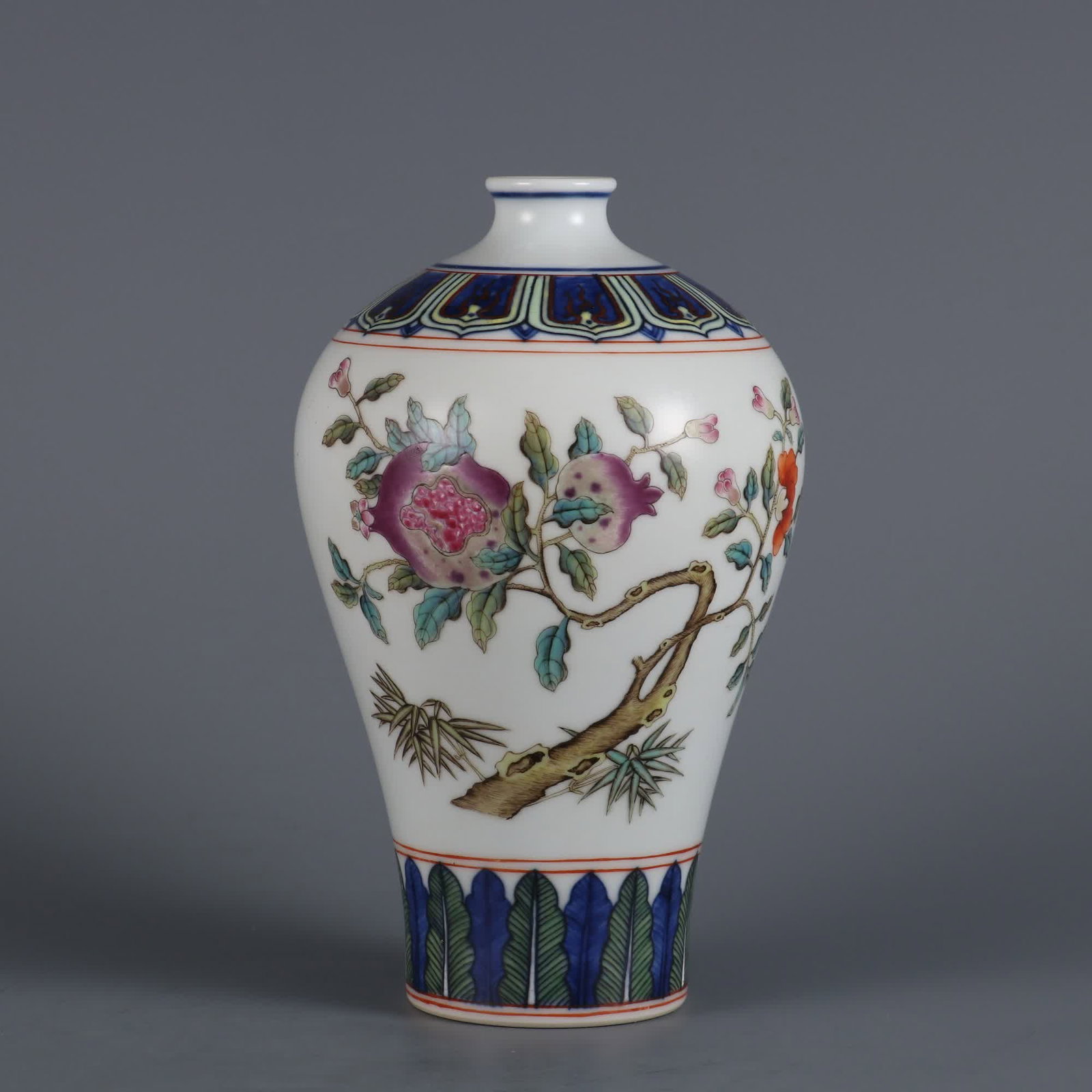 A Qing Dynasty Qianlong year blue powder colored pomegranate pattern plum bottle: Qing Dynasty Qianlong year blue powder color pomegranate pattern plum bottle SIZE: H:16.5cm MouthD:2.5cm (The Dimensions Of All Batches Are Manually Measured.If You Need More Detailed Information, Ple