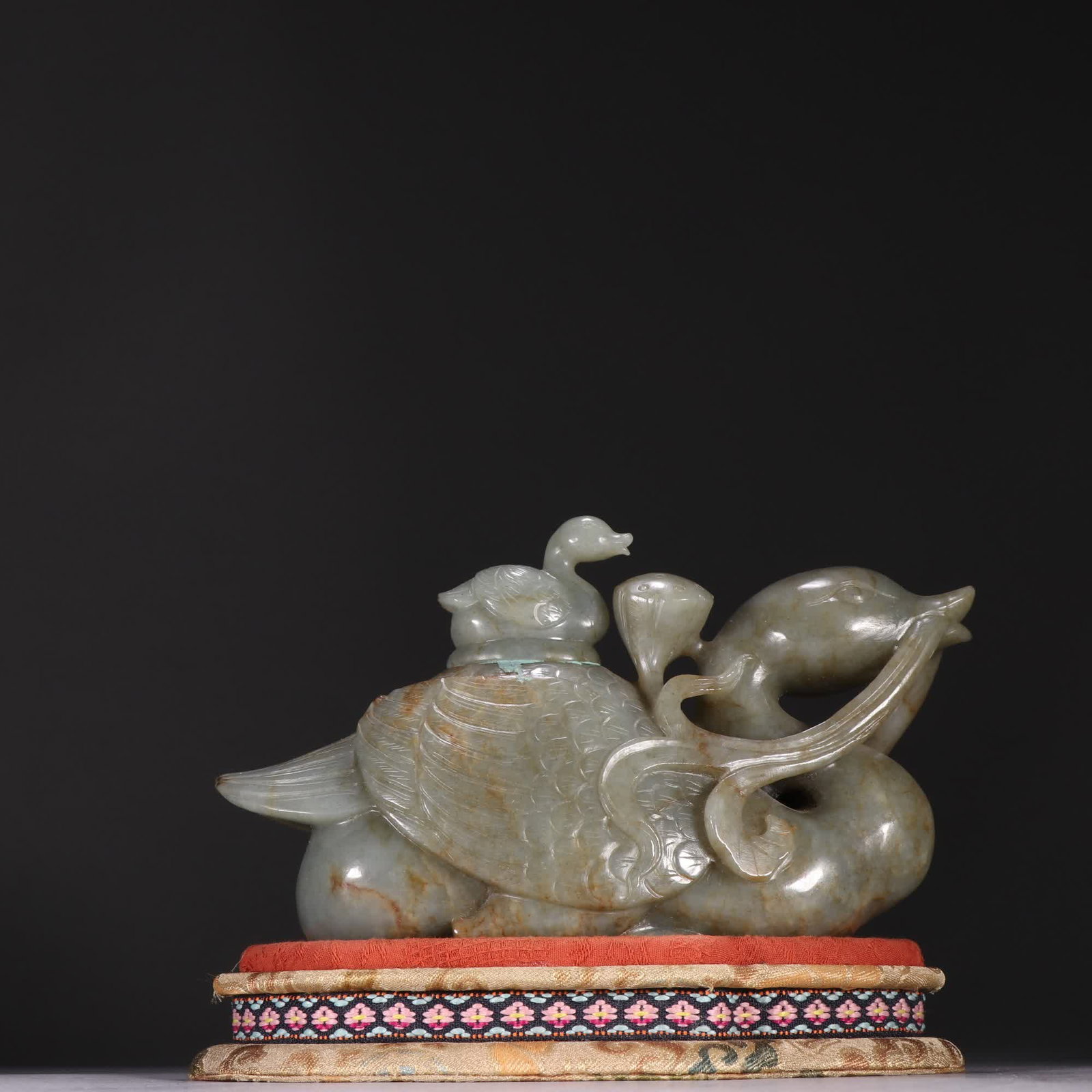 A Qing Dynasty Hetian jade seed material treasure duck ornament wearing lotus: Qing Dynasty Hetian jade seed material treasure duck lotus ornament SIZE: H:11cm W:18cm W:980g (The Dimensions Of All Batches Are Manually Measured.If You Need More Detailed Information, Please Contac