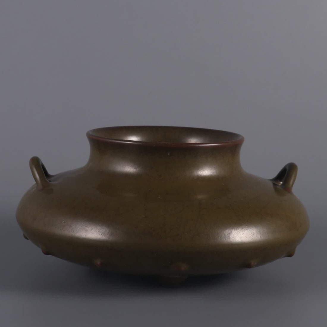 A Qing Dynasty Qianlong tea powder glazed double-tie drum nail jar (1 of 8)