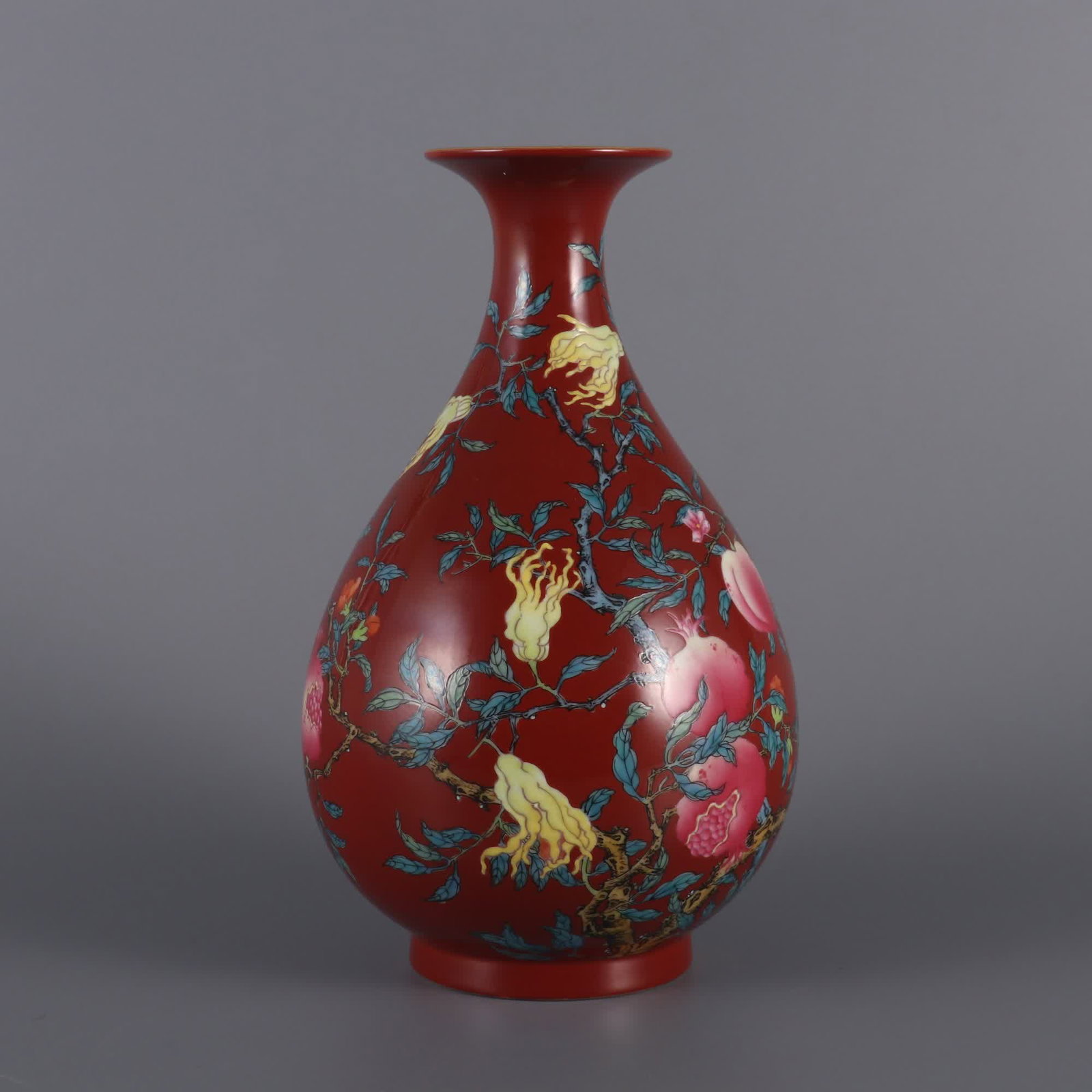 A Qing Dynasty Yongzheng year coral red background pastel three multi-pattern jade pot spring vase: Qing Dynasty Yongzheng year coral red background pastel three multi-pattern jade pot spring vase SIZE: H: 20.2cm Belly diameter 11cm MouthD: 5.8cm (The Dimensions Of All Batches Are Manually Measured.