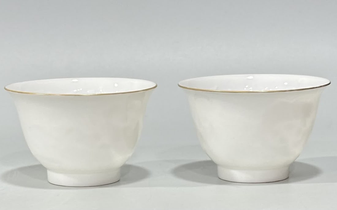 A Qing Dynasty Yongzheng sweet white glaze engraved with fish and algae pattern thin tire cup (1 of 6)