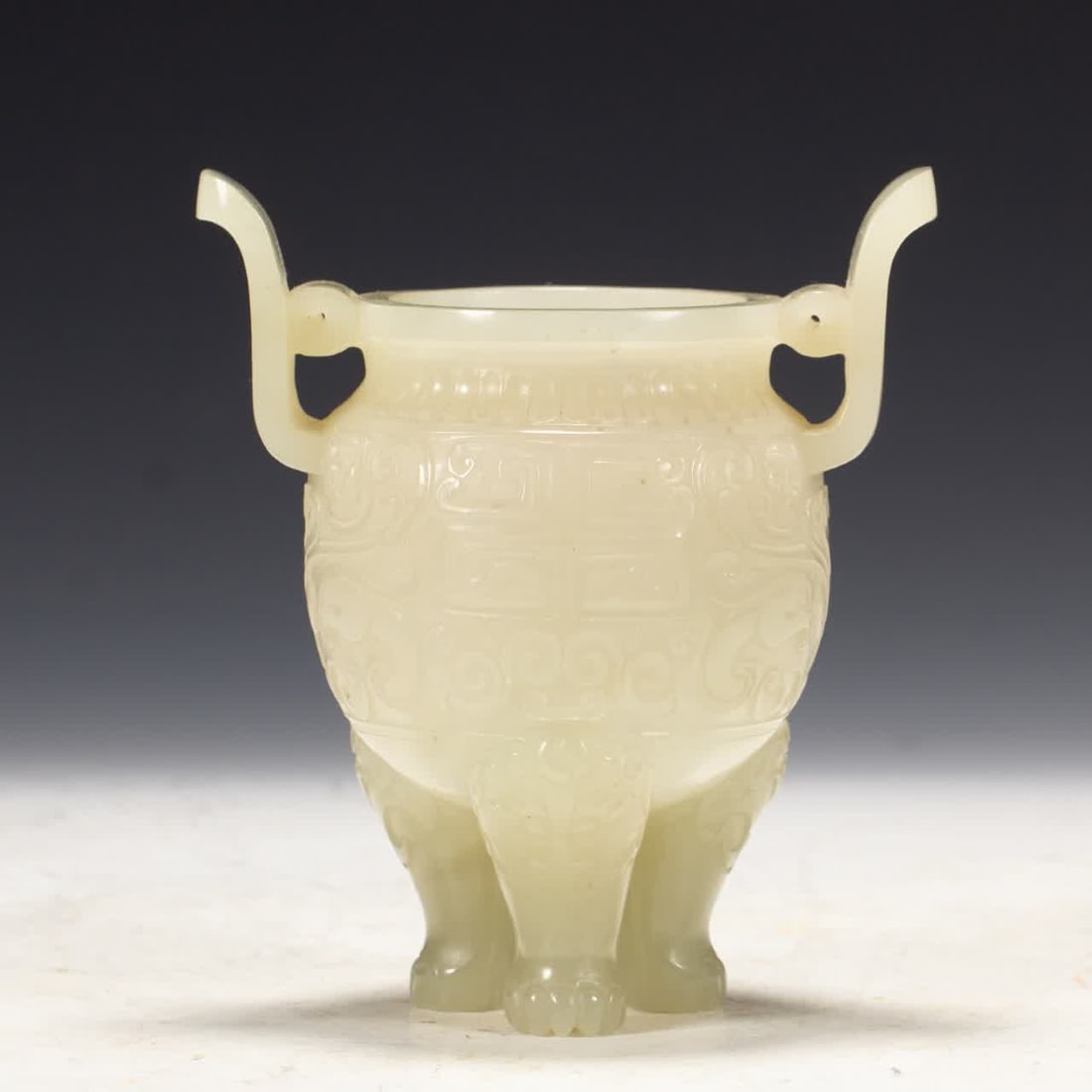 A Qing Dynasty Hetian jade three-legged furnace ornament: Qing Dynasty Hetian jade three-legged furnace ornament SIZE: L:11.2cm W:8cm H:13cm W:350g (The Dimensions Of All Batches Are Manually Measured.If You Need More Detailed Information, Please Contact