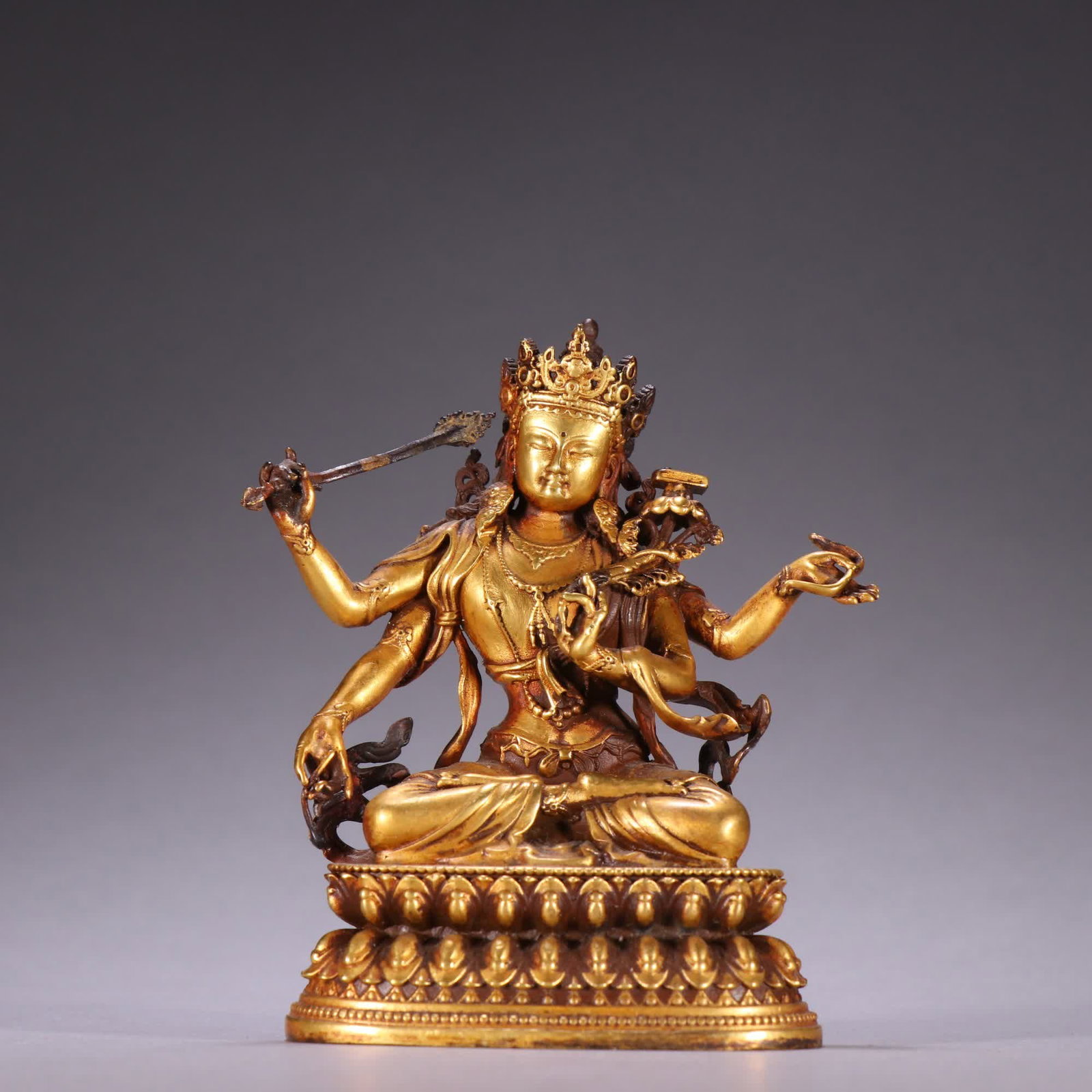 A copper-gilt four-armed Manjushri Bodhisattva in the Qing Dynasty (1 of 9)
